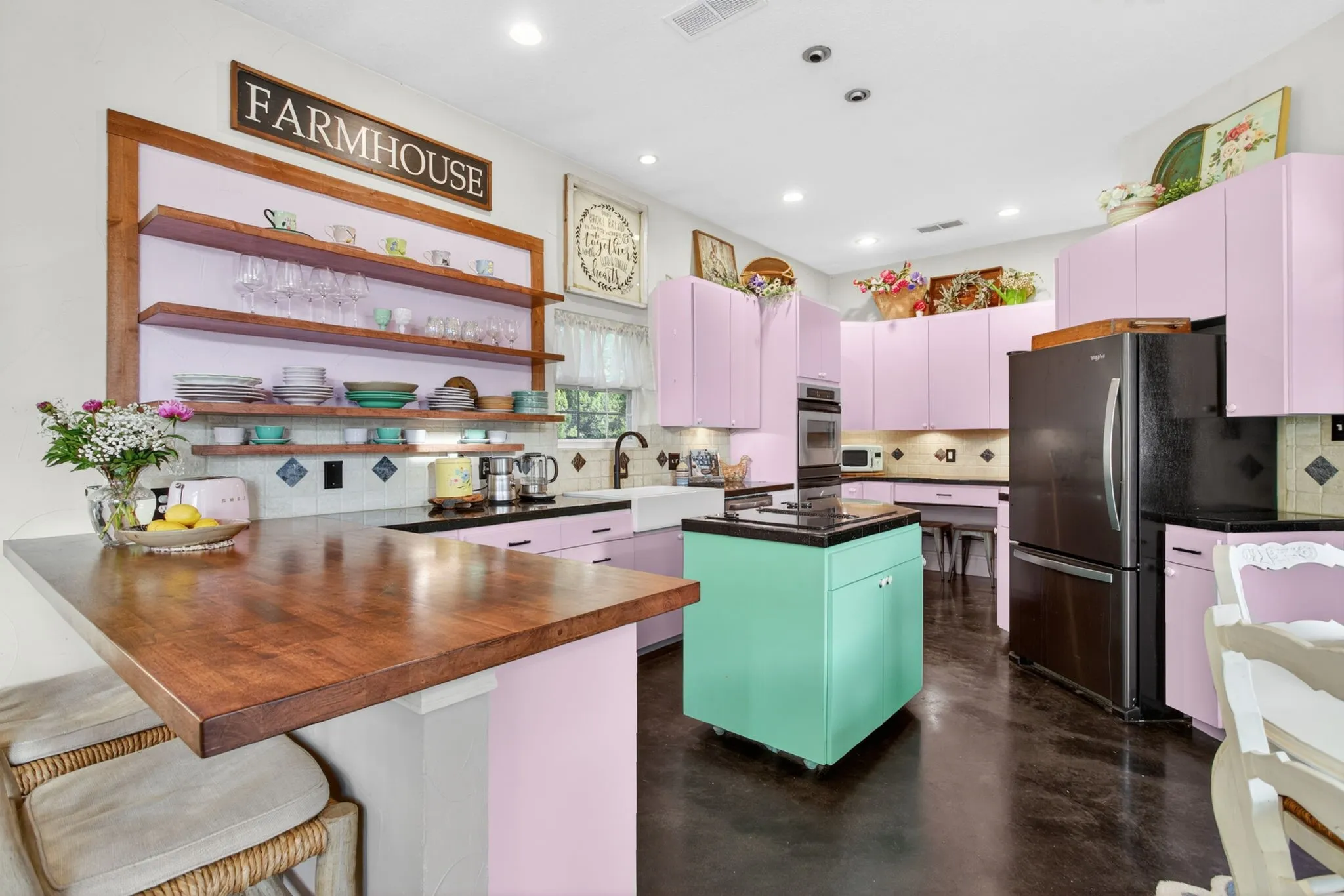 Whimsey and joy. A signature pink kitchen with cottage core touches and farmhouse details.