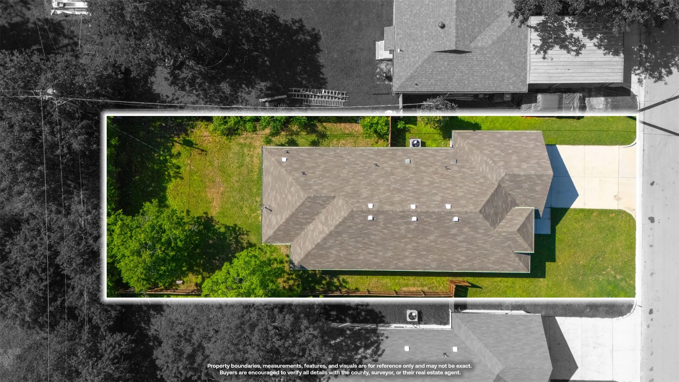 Property featuring a multi-gabled roofline, concrete driveway, and established green lawn