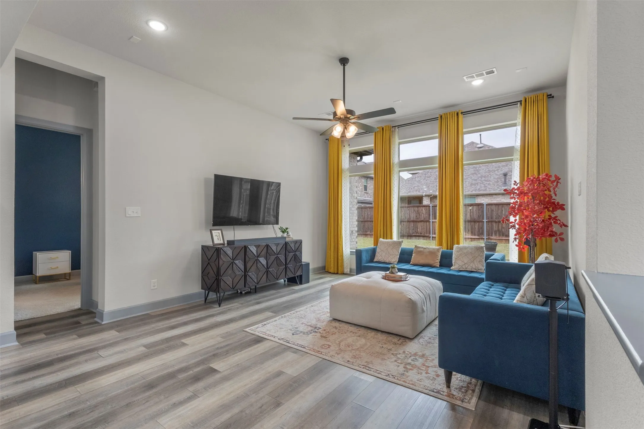 Spacious living area featuring LVP flooring throughout