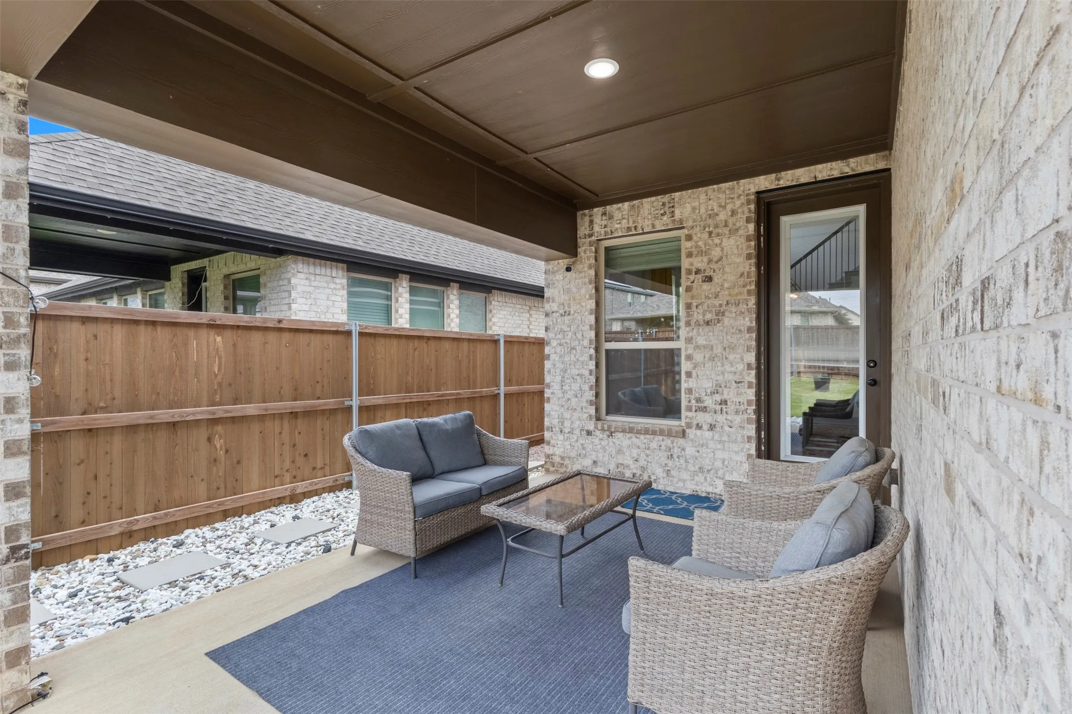 Covered patio with opening area facing north and east.