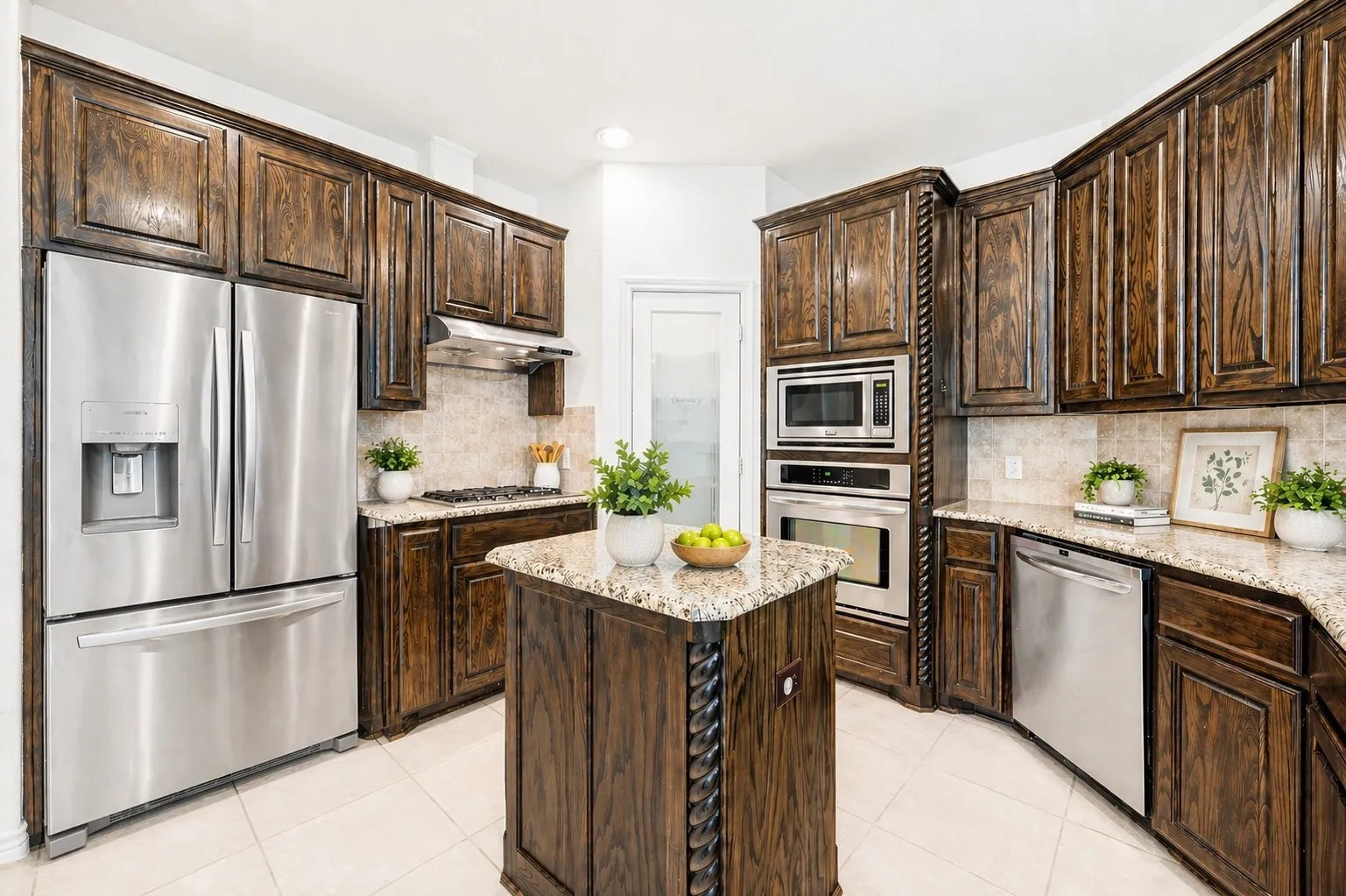 Gourmet kitchen featuring dark wood cabinetry, stainless steel appliances, a center island with a granite countertop, and tile flooring. virtually staged photo
