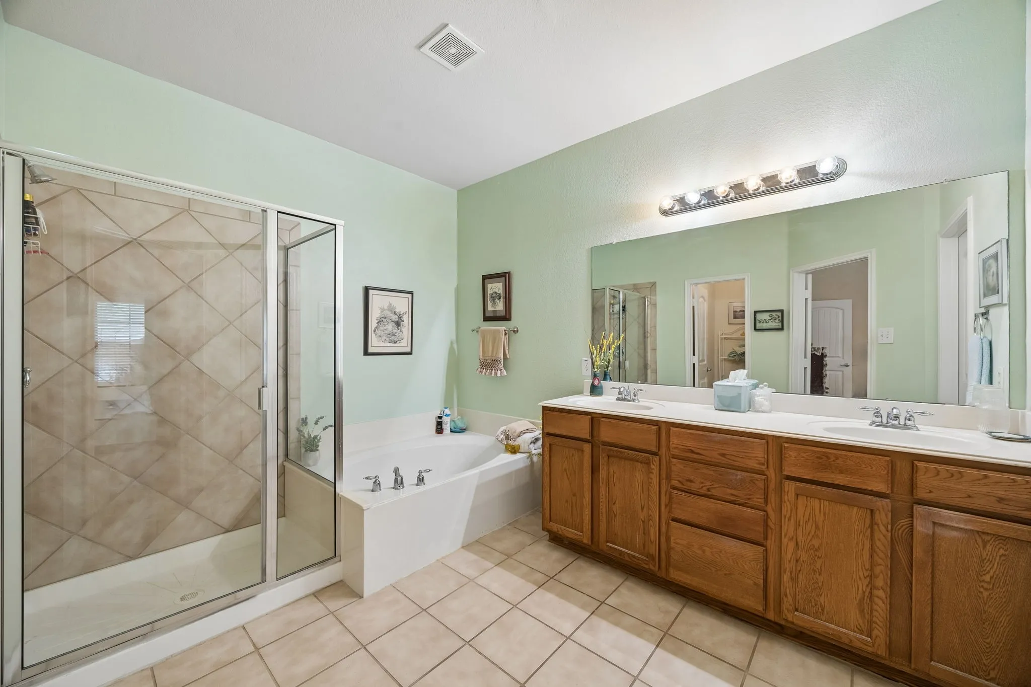 And now the AMAZING primary ensuite, complete with double sinks - lots of storage - inviting soaking tub - and large separate shower!