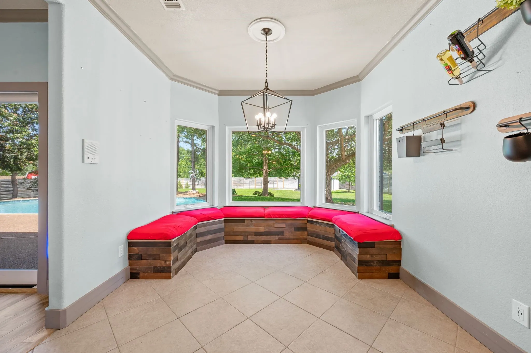 The built in bench seating in this large breakfast room also provides extra storage. Each bench seat has trunk space beneath the cushions.