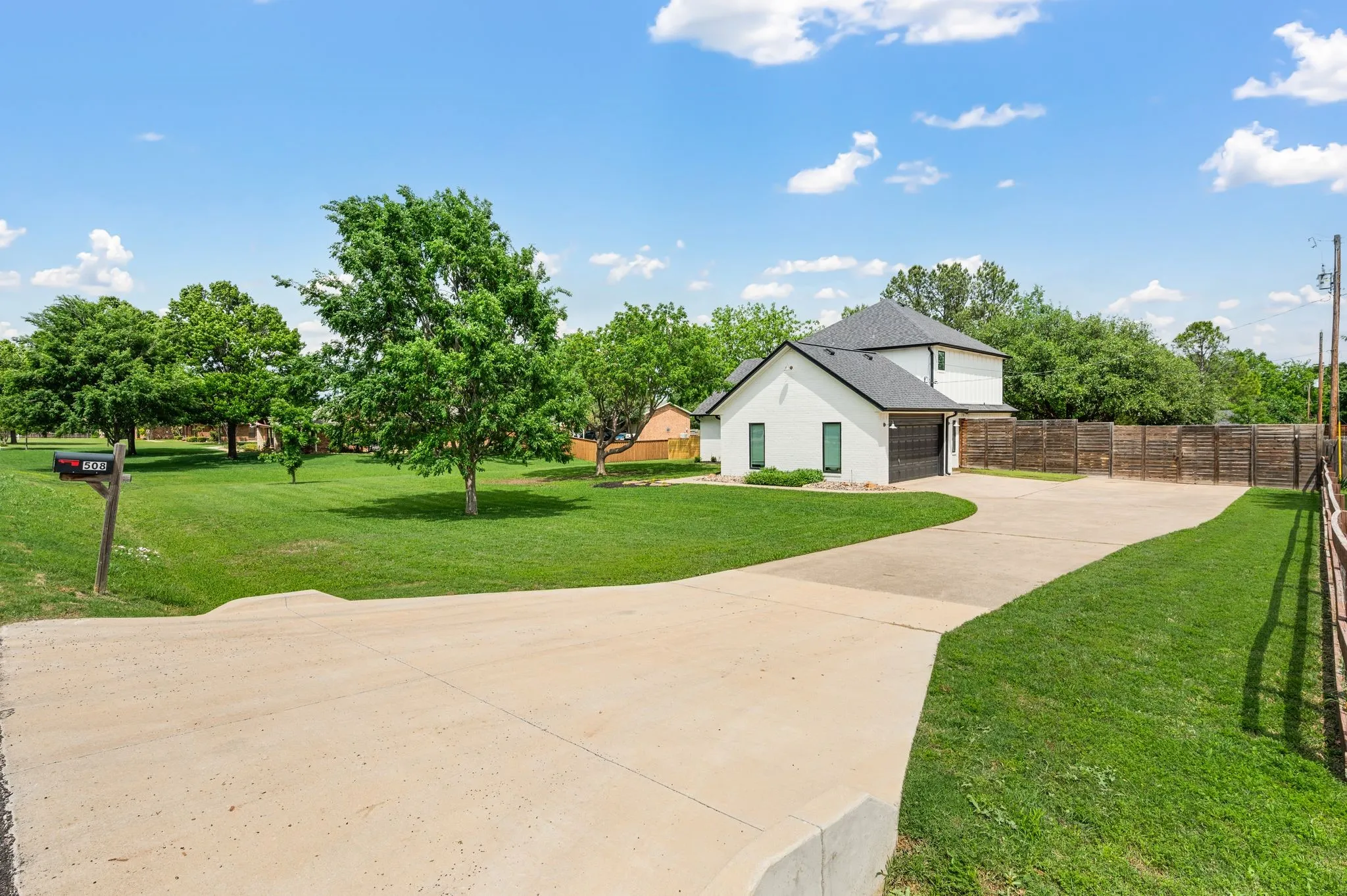 This long stretch of driveway goes well beyond the double wide gate for camper and boat parking. The garage door is WiFi and app ready. The garage door opener was replaced in 2025 and the garage door spring replaced in 2024.