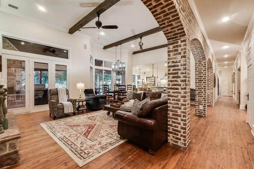 View of brick accents in hallway and living area