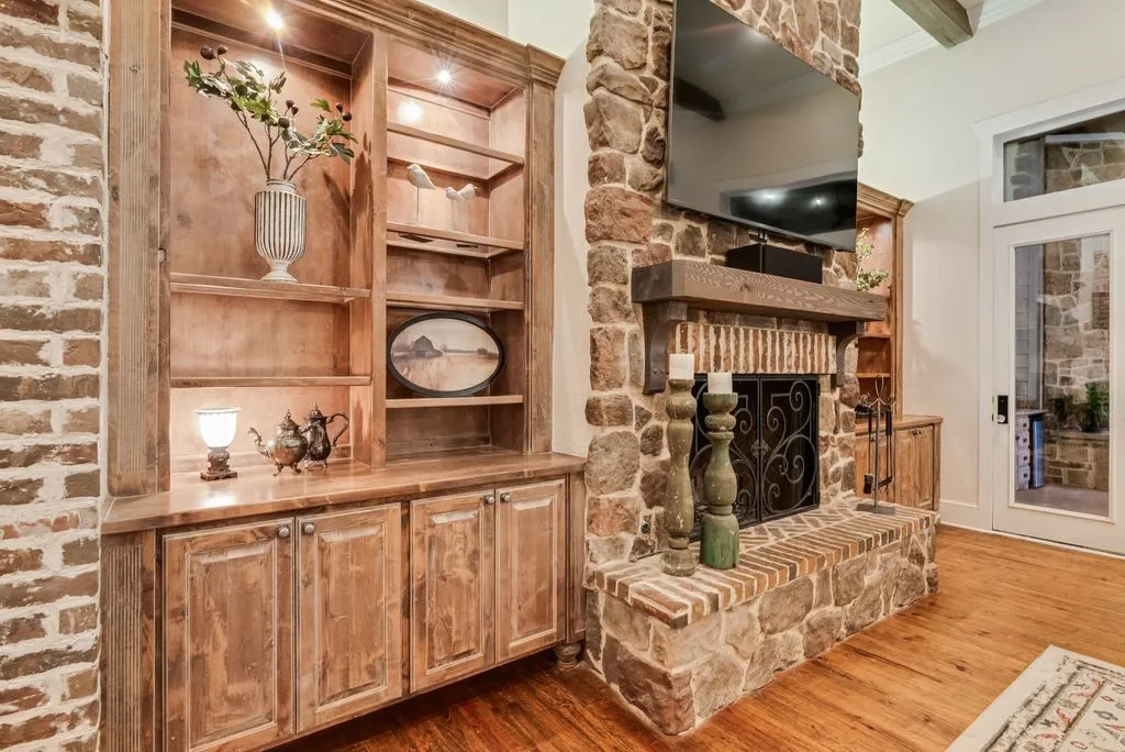 Floor to ceiling stone fireplace and built-ins
