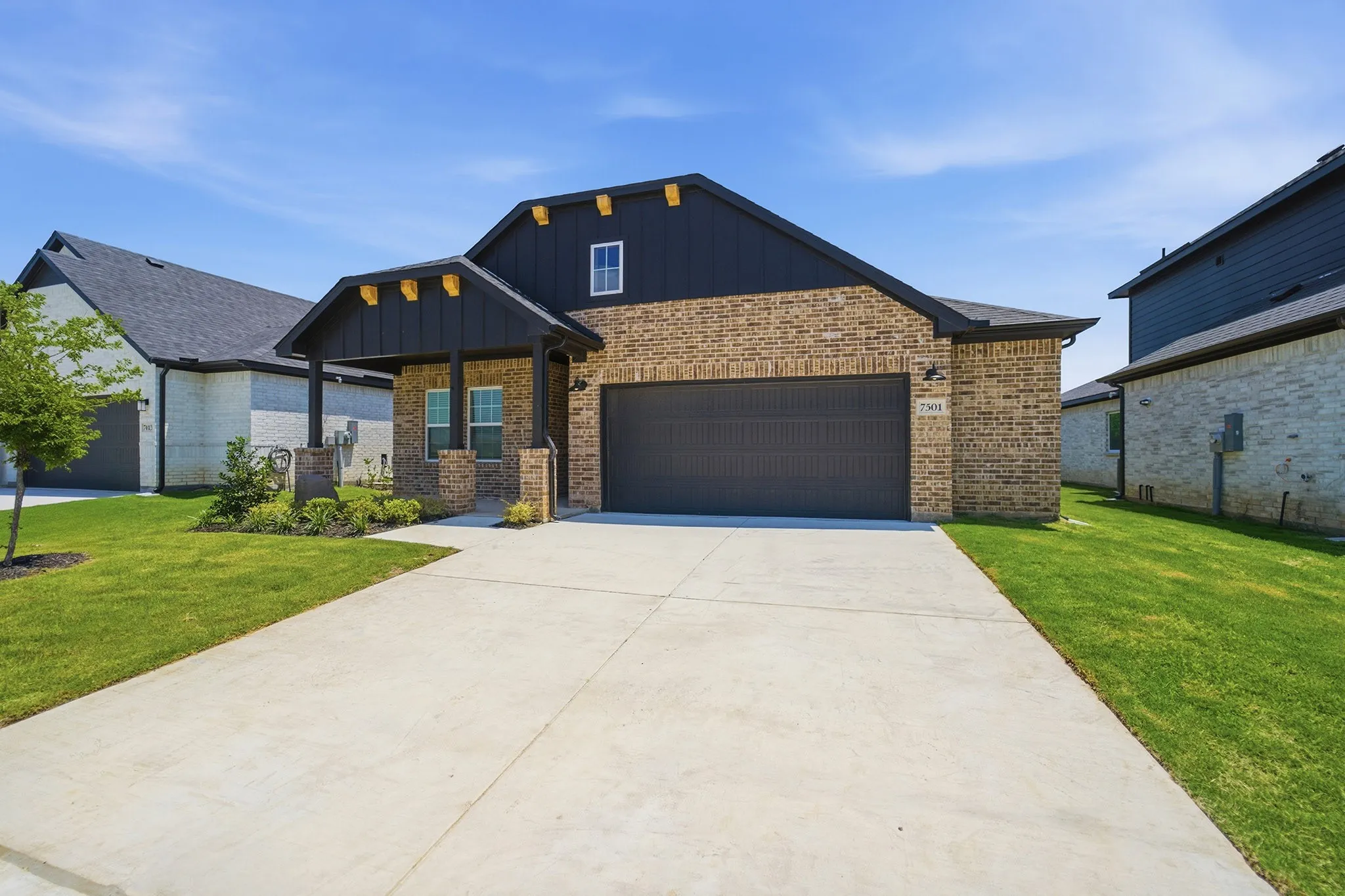 Brick exterior with dark siding accents