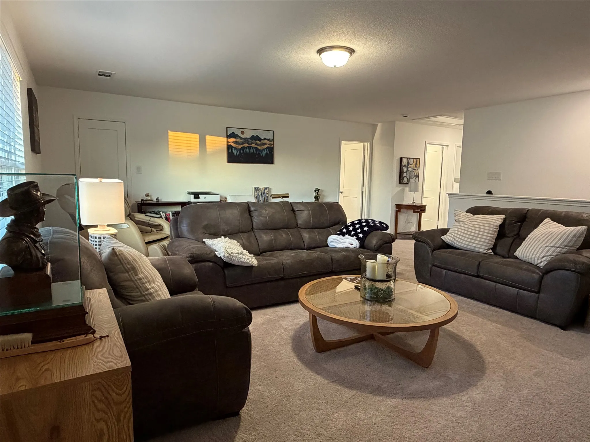 Three Generously Sized Bedrooms and Two Additional Full Baths Down Hall to the Right