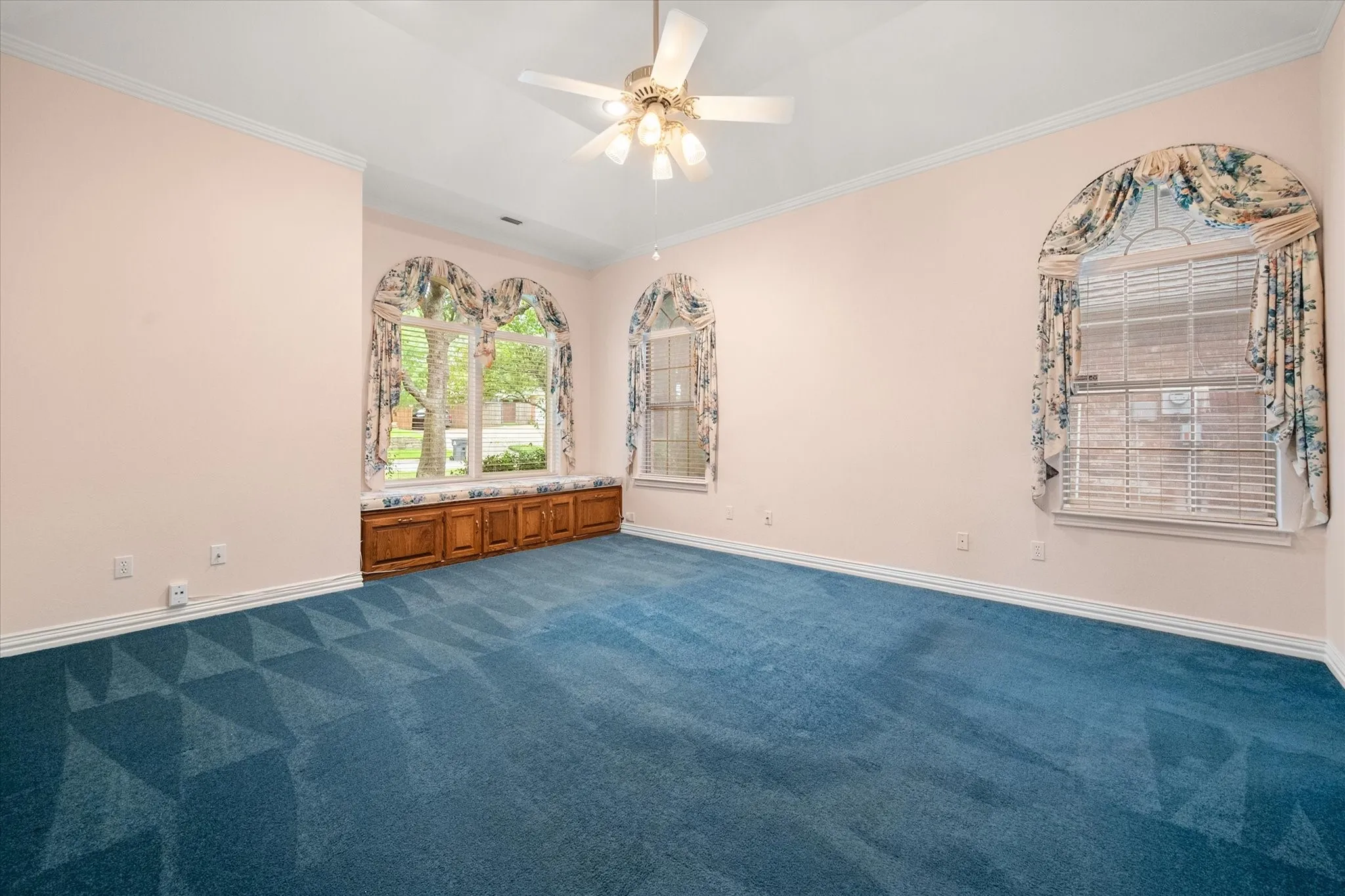 Primary bedroom with bench seating