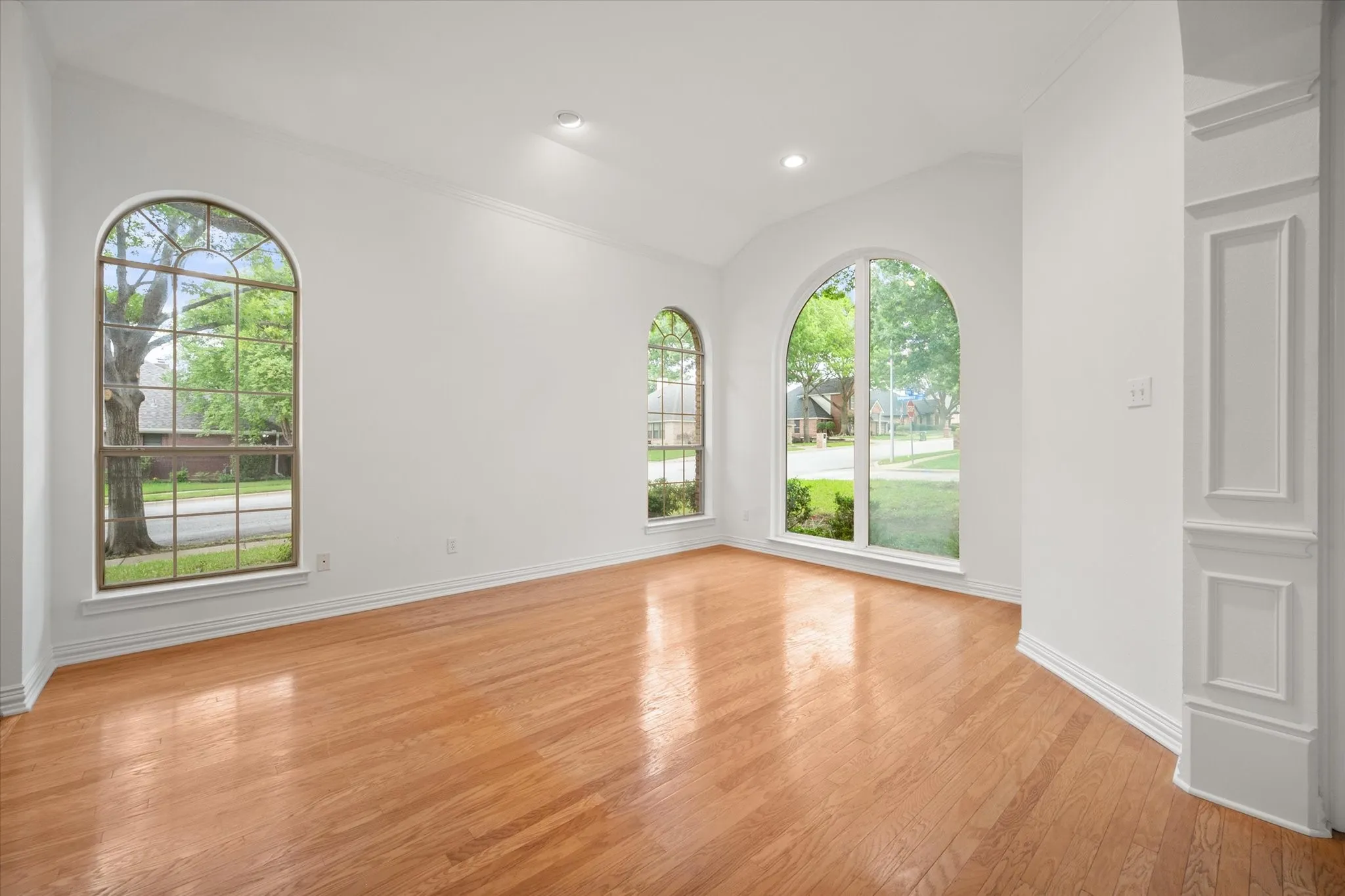 Front entry and living room with hardwood flooring