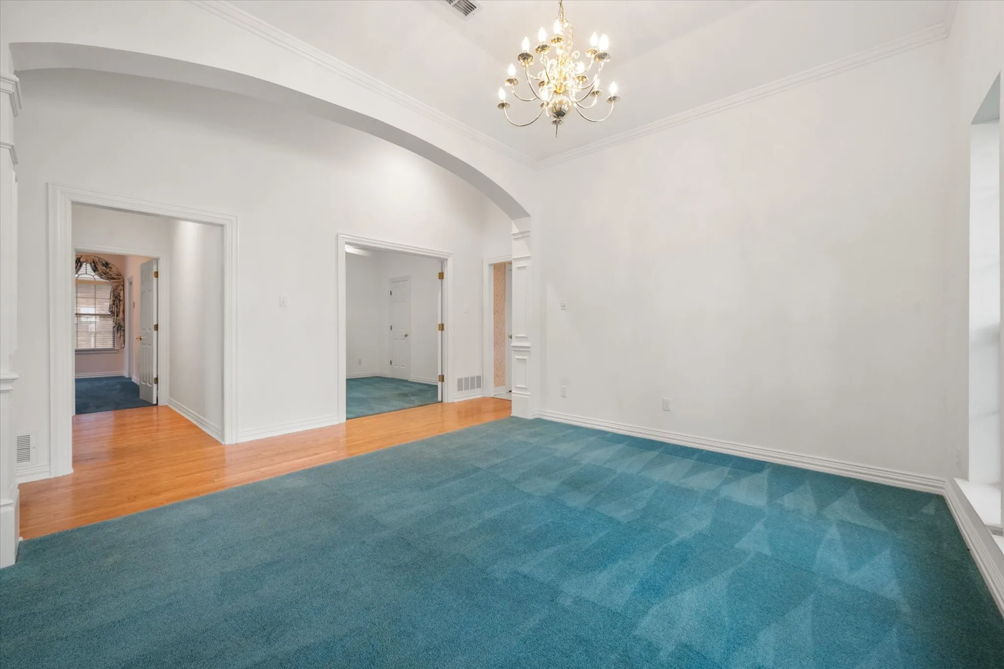 The hall leads to the primary bedroom and right is the office