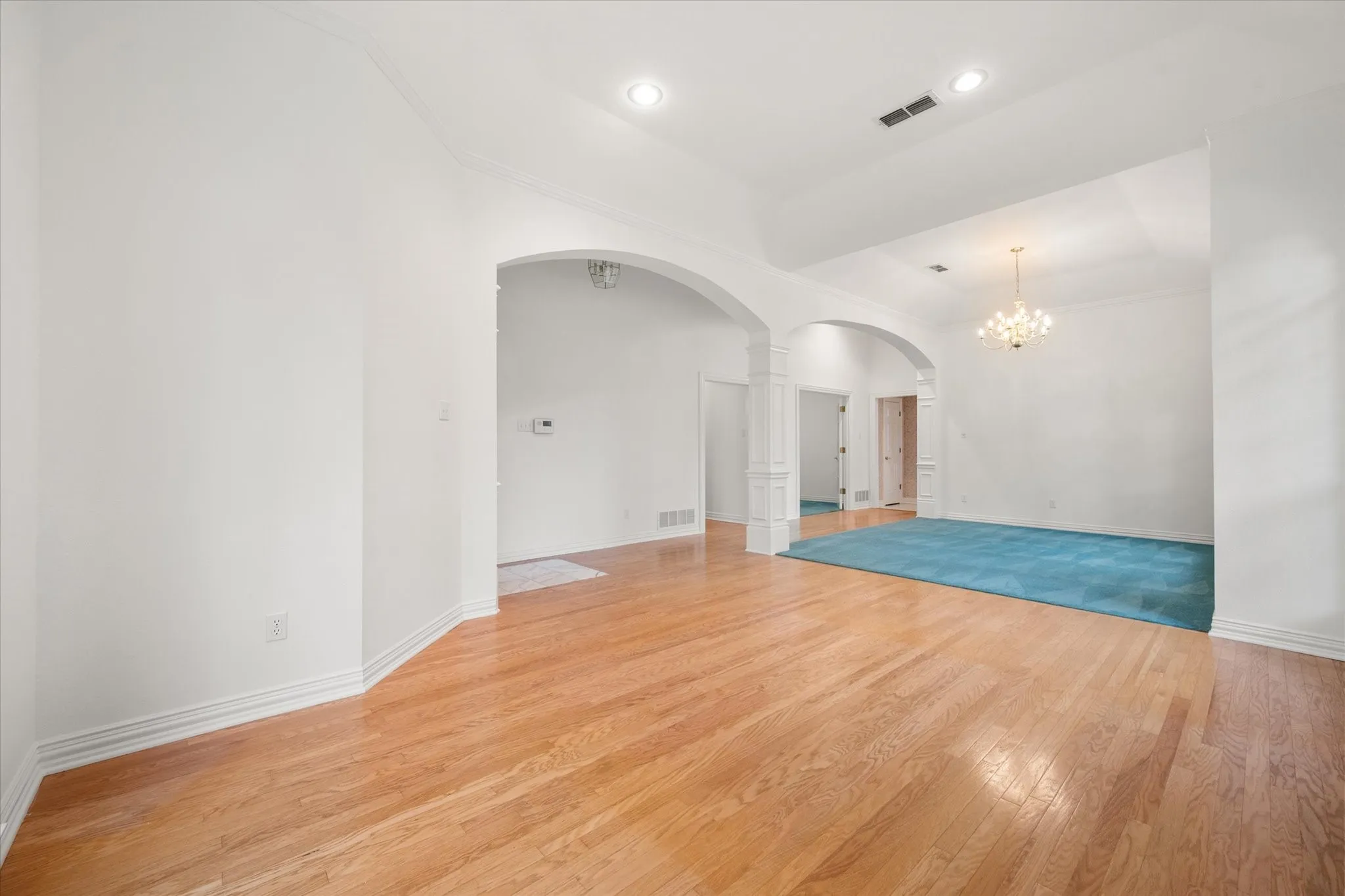 Front entry living  with hardwood flooring and formal dining rooms