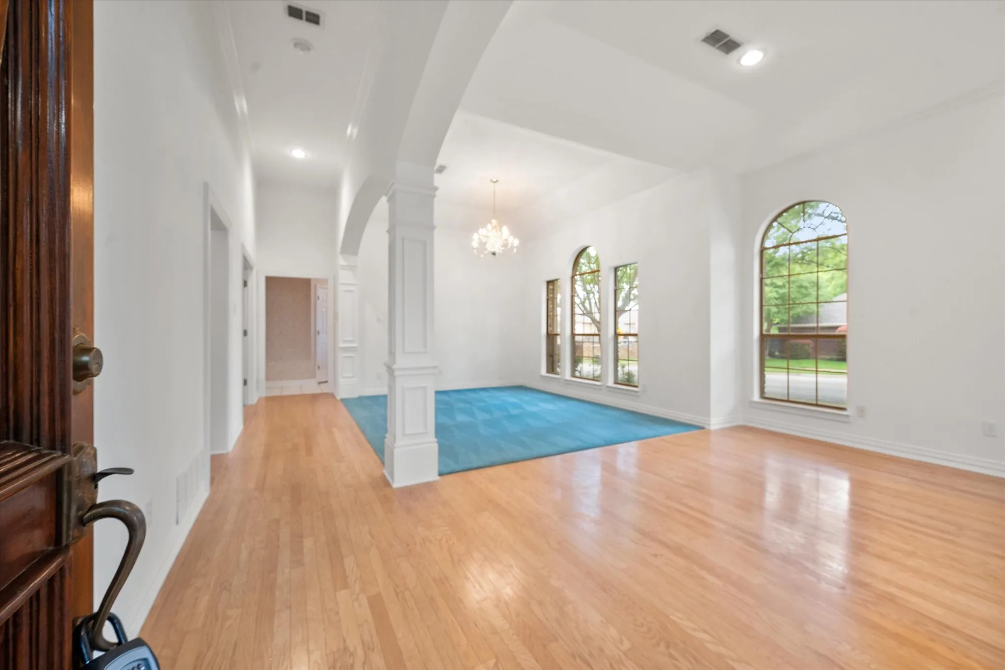 Front entry living  with hardwood flooring and formal dining rooms