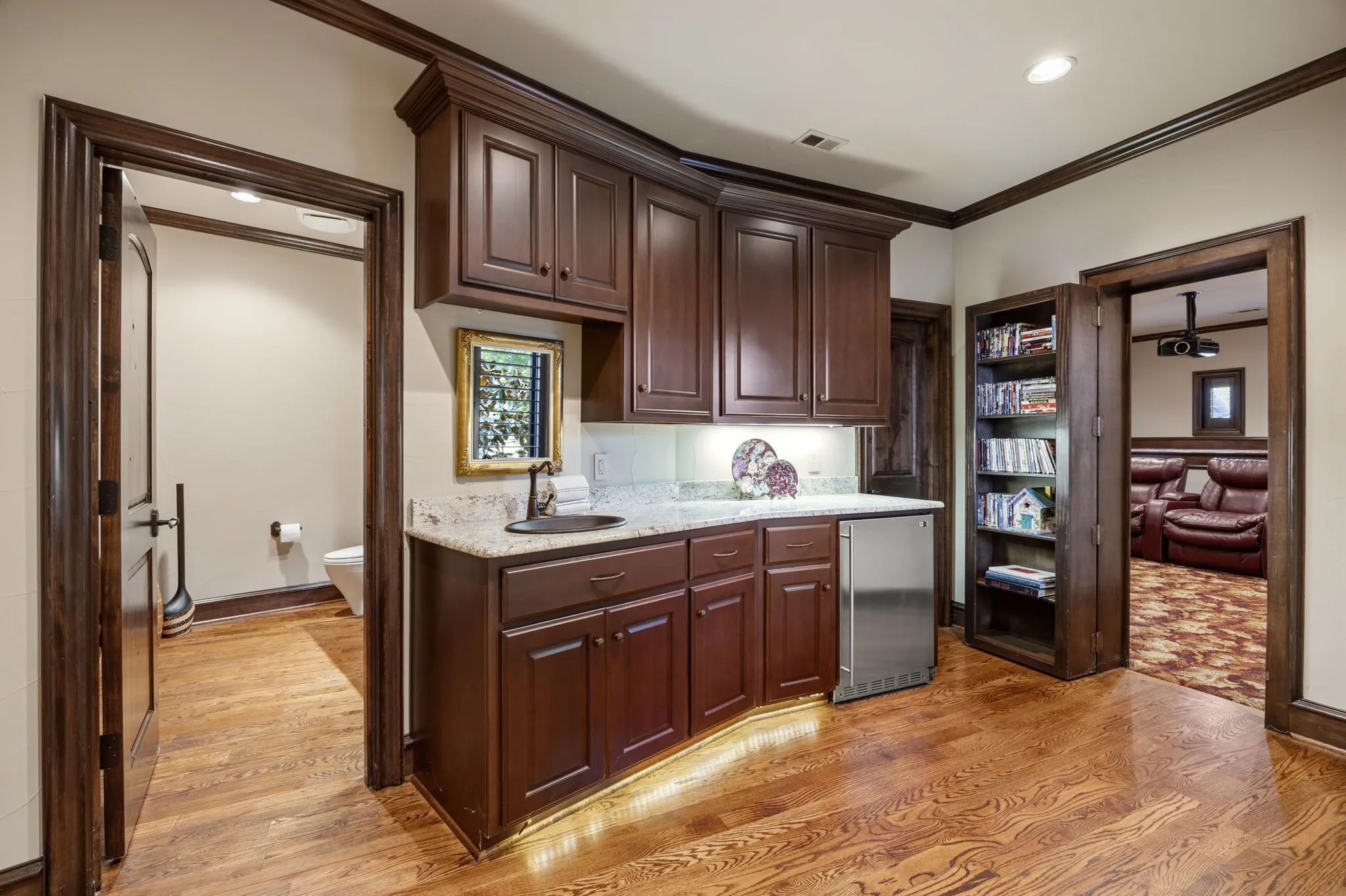 View of Wet Bar, Media Room and Attached Half Bathroom