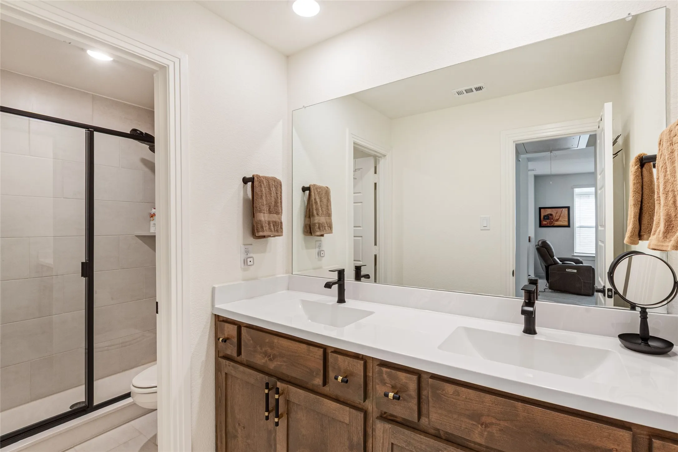 Second Level Bathroom with Dual Sinks and a Shower
