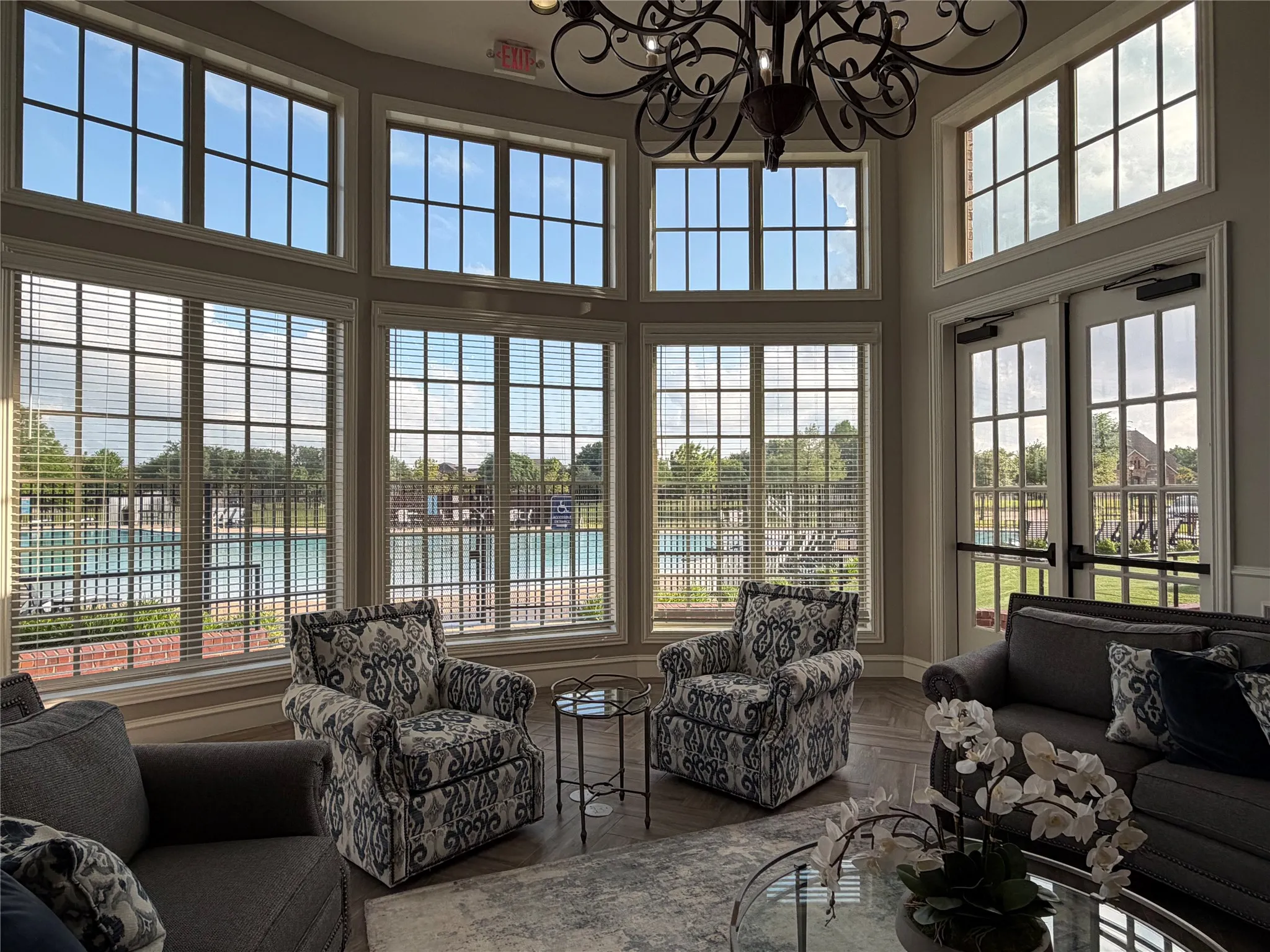 View from Central Room in Club House. The Amenities Include: an Resort Style Pool; a Smaller Pool for Children Five Years and Younger; a Clubhouse with Fitness Center, Restrooms, Flat Screen TV, Kitchen, Along with an Open Area for Entertainment. Clubhouse is available for Reservation by Williamsburg Home Owners.