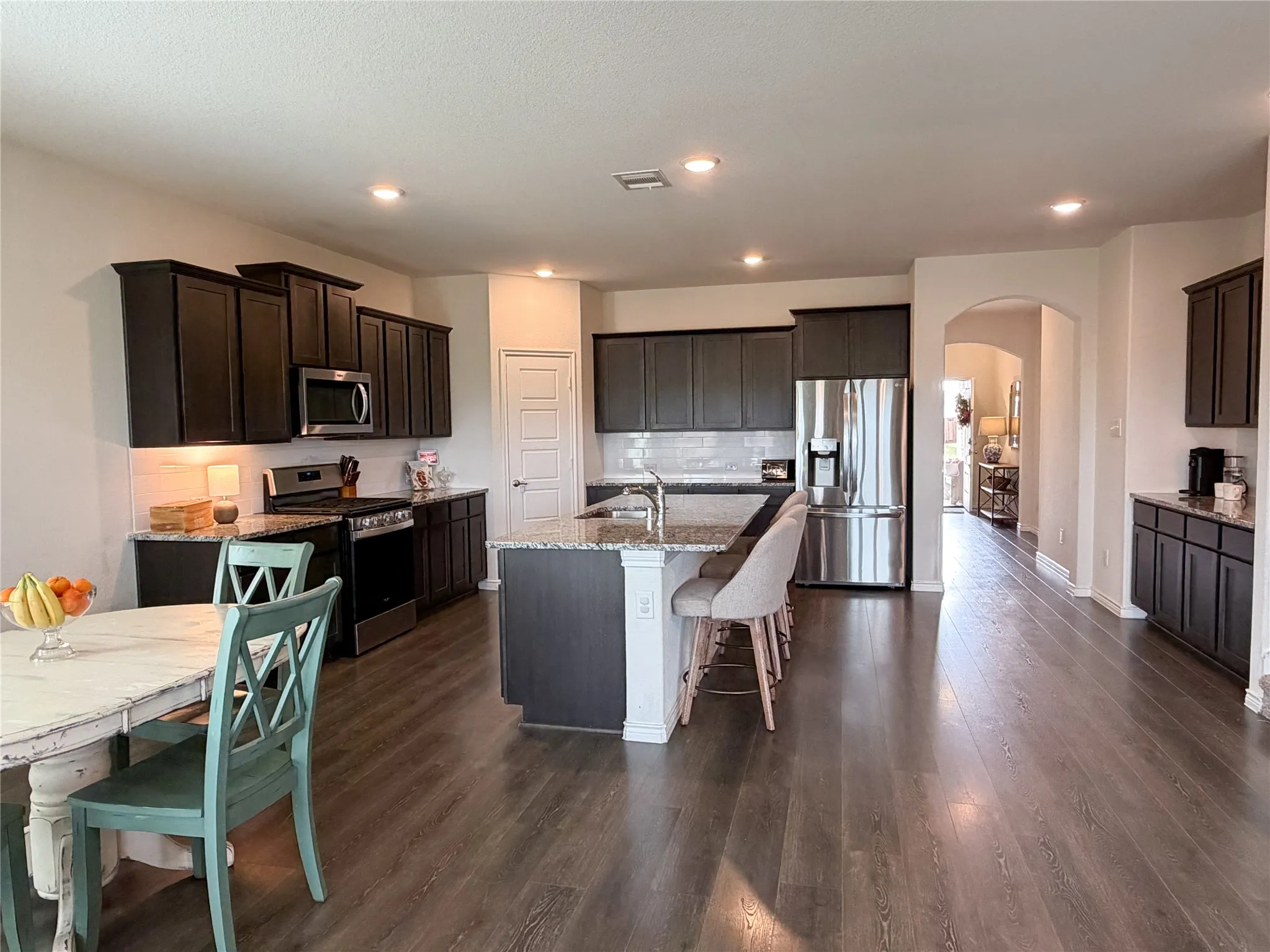 Massive 20 x 15 Kitchen Complete with Sleek Granite Counters, Large Subway-Tile Backsplash and Stainless-Steel Appliances with Gas Range. You’ll Especially Love the Oversized Coffee Bar with Plenty of Extra Cabinet Space