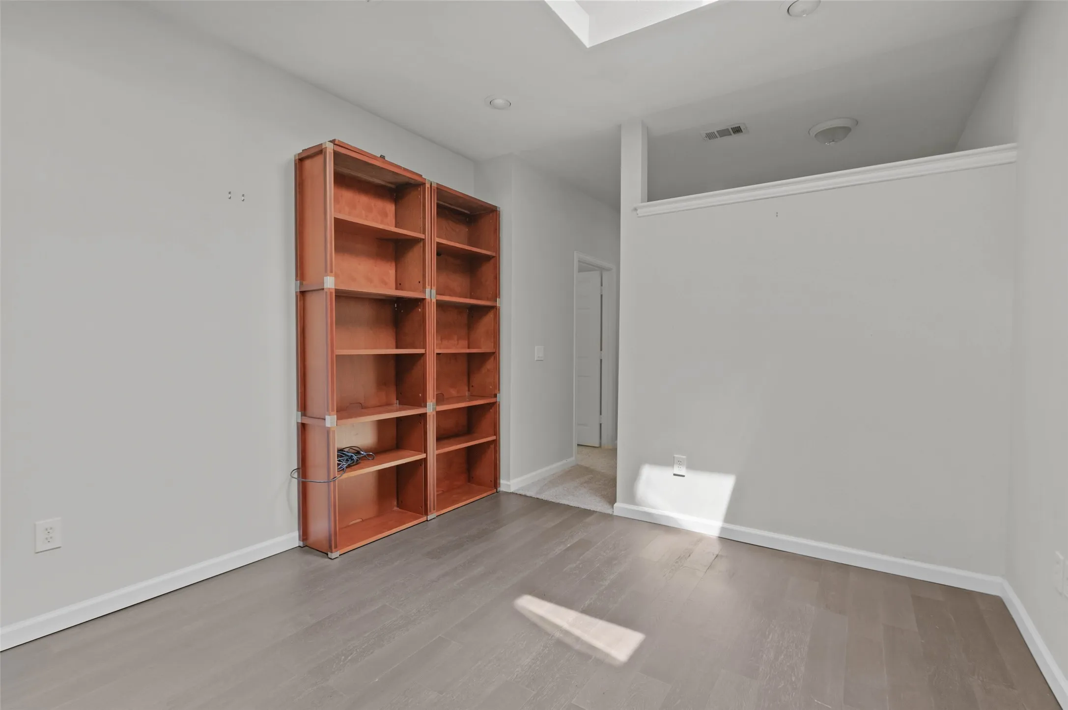 This spacious room is off the primary bathroom and could be used for many purposes.