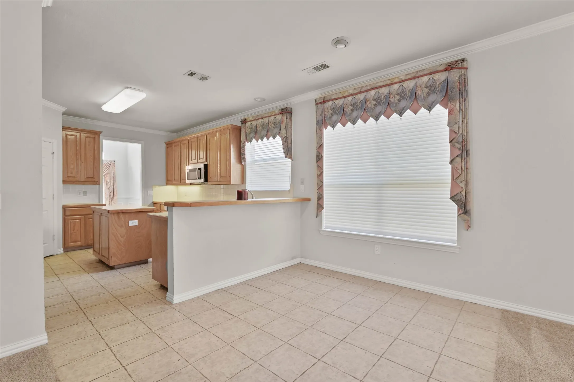 View from the living room of the breakfast area and kitchen.