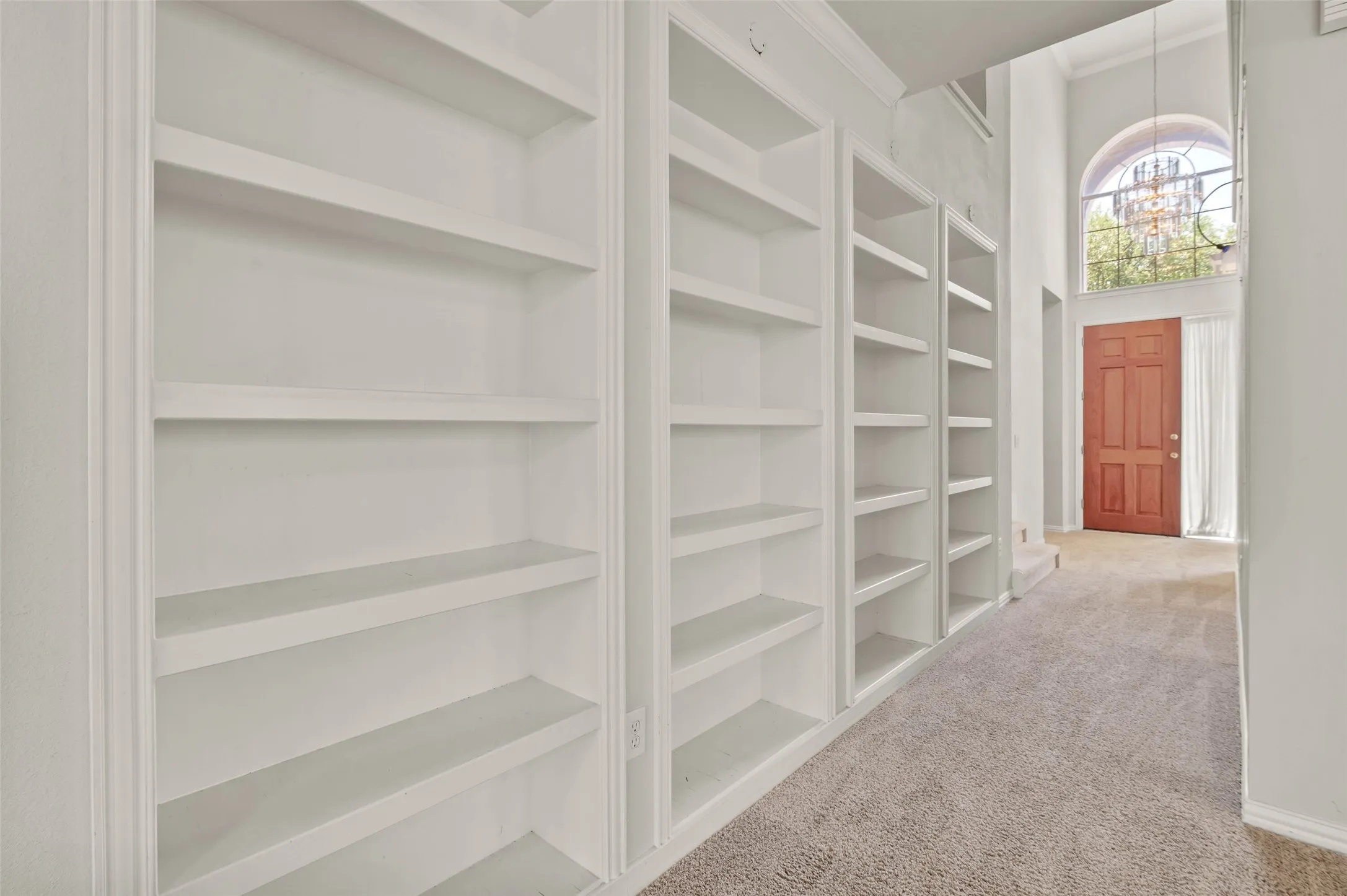 View of the entry way with beautiful built-in shelving.