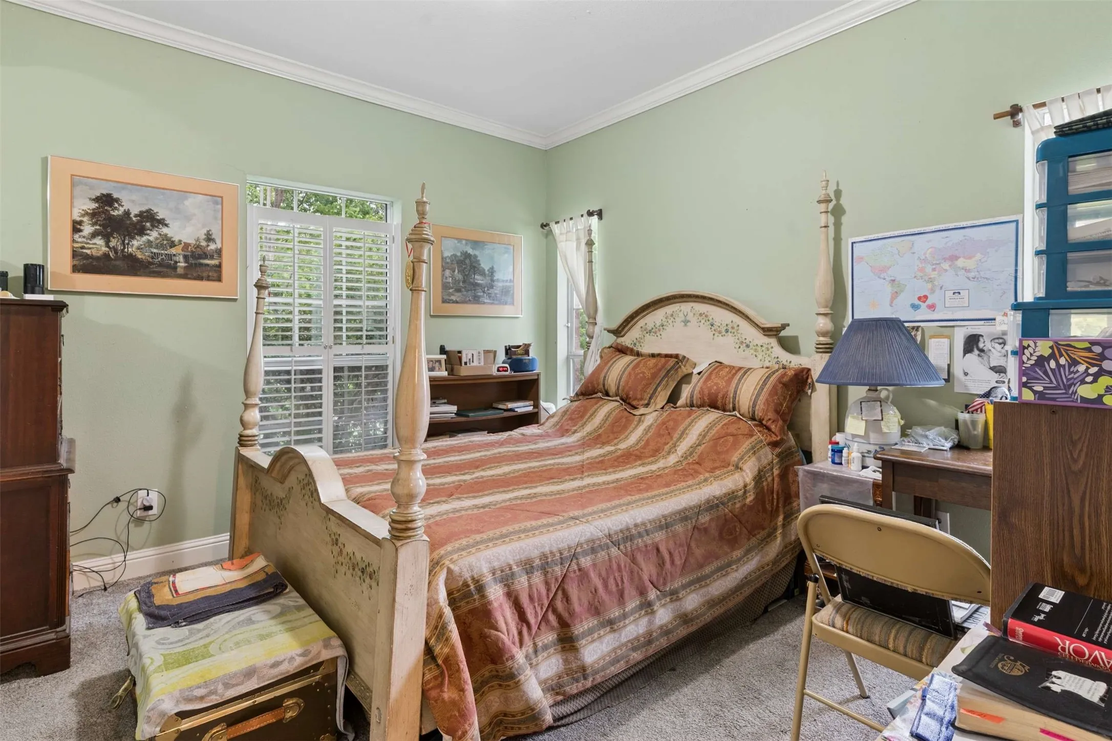 Neutral-toned walls with chair rail molding and plush carpet flooring