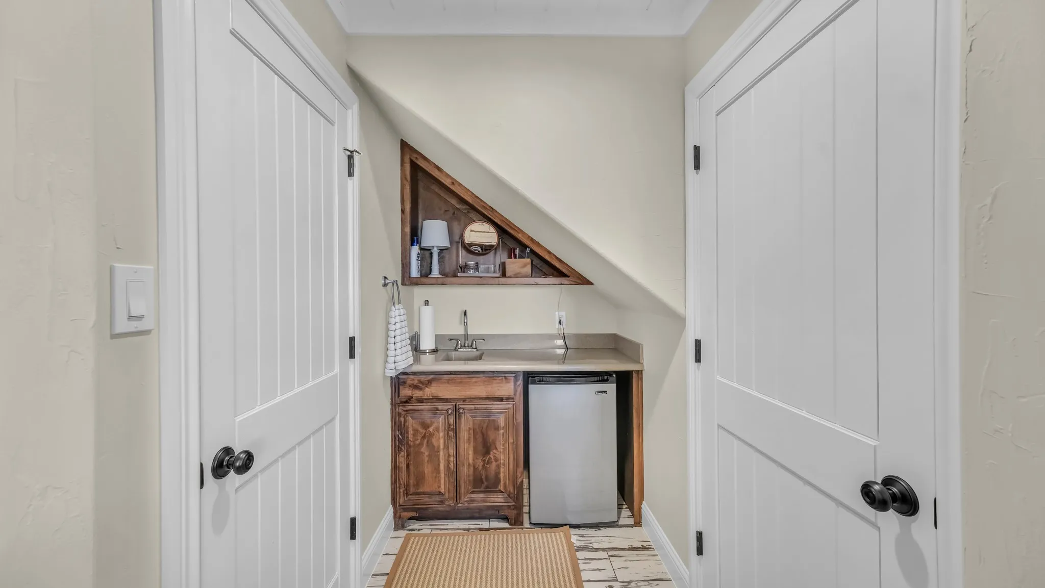 Downstairs 5th bedroom has a sink, cabinets, and mini fridge area also. Walk in closet on the right.