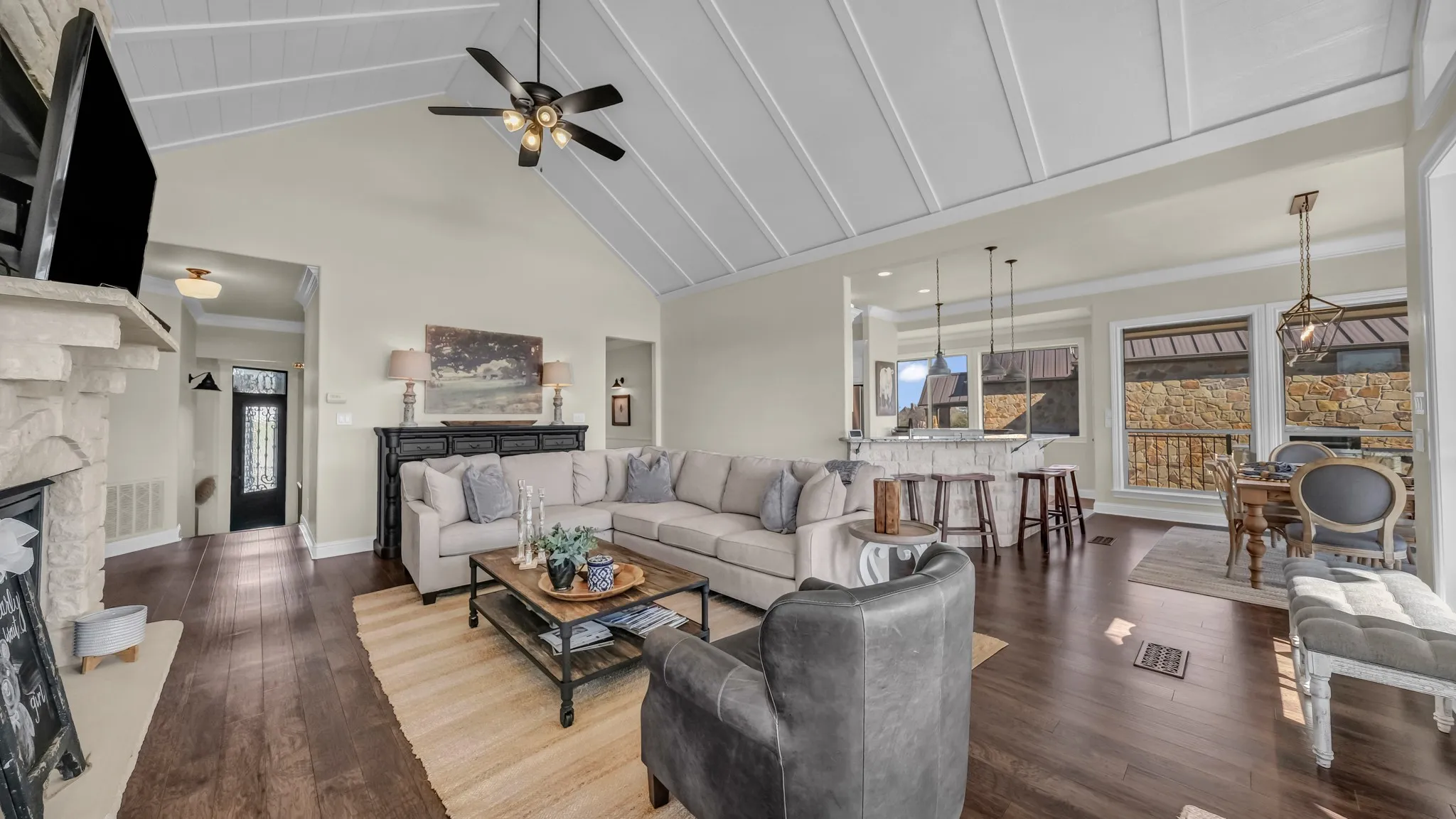 You can see the front door to the left of the picture. Fully remodeled open concept living, dining, kitchen area with vaulted ceilings.