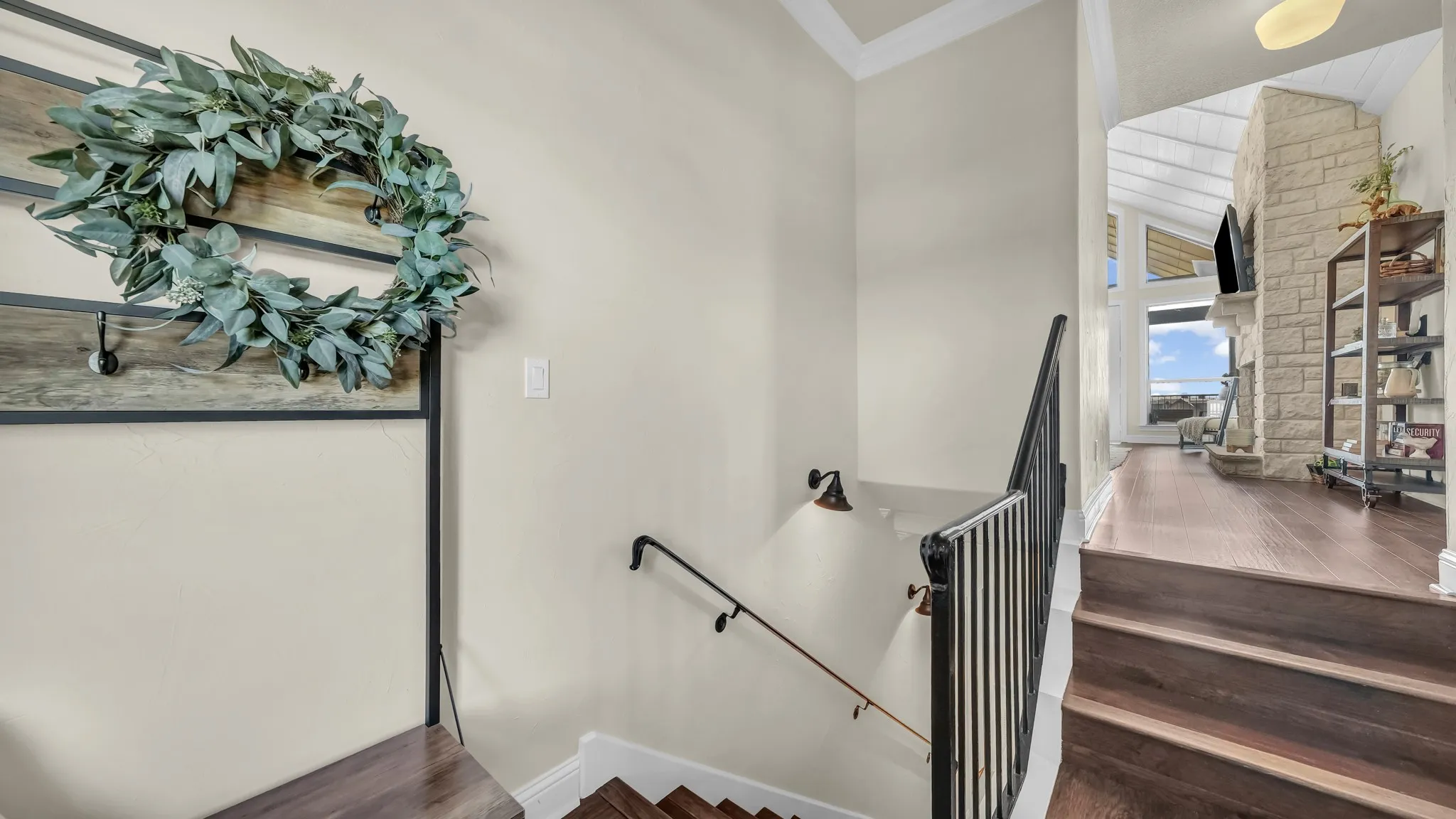This staircase leads downstairs to the private 5th bedroom upon enterting the main floor.