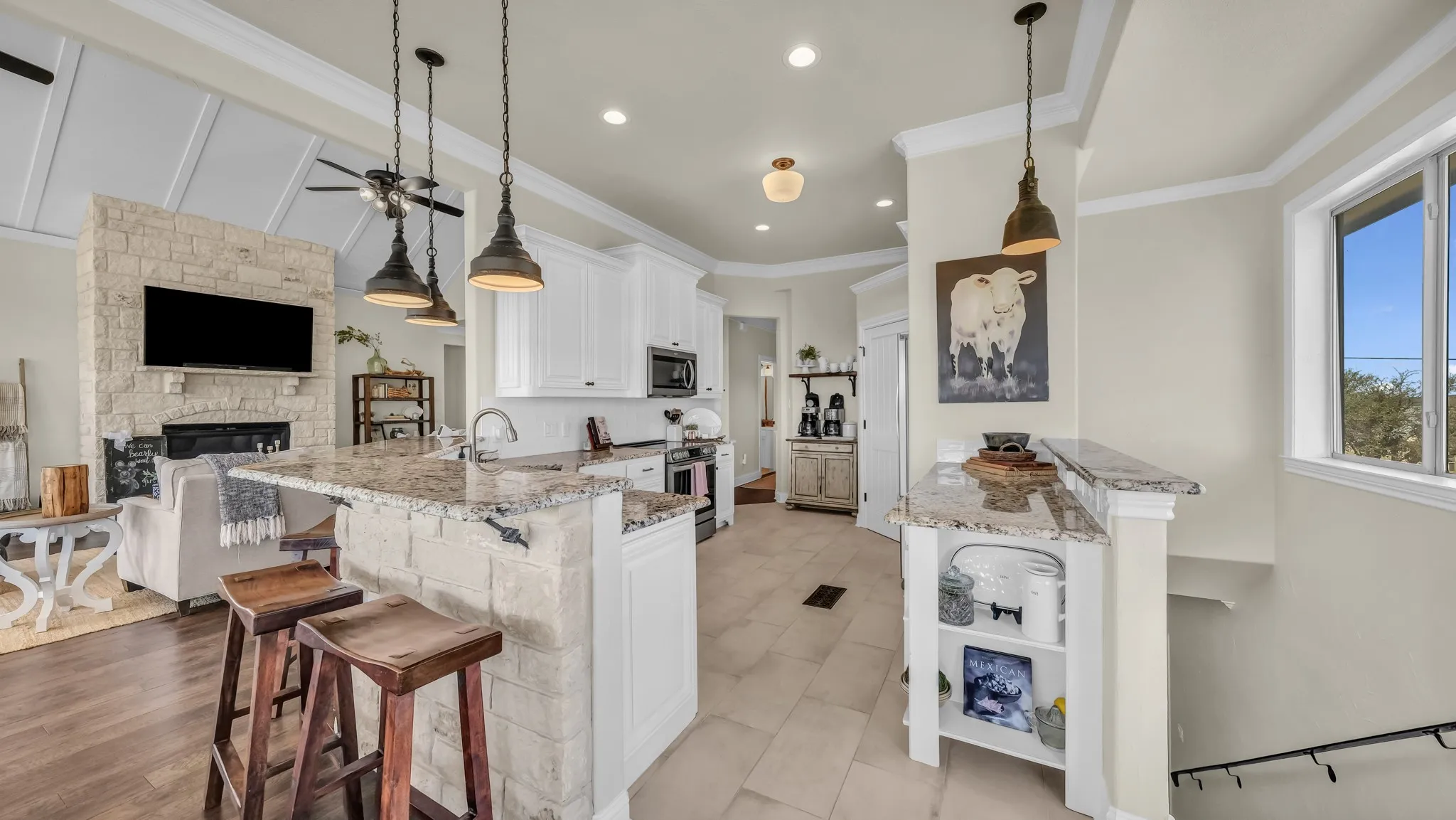 Breakfast bar area in kitchen.  Stairs to right lead down the to garage.