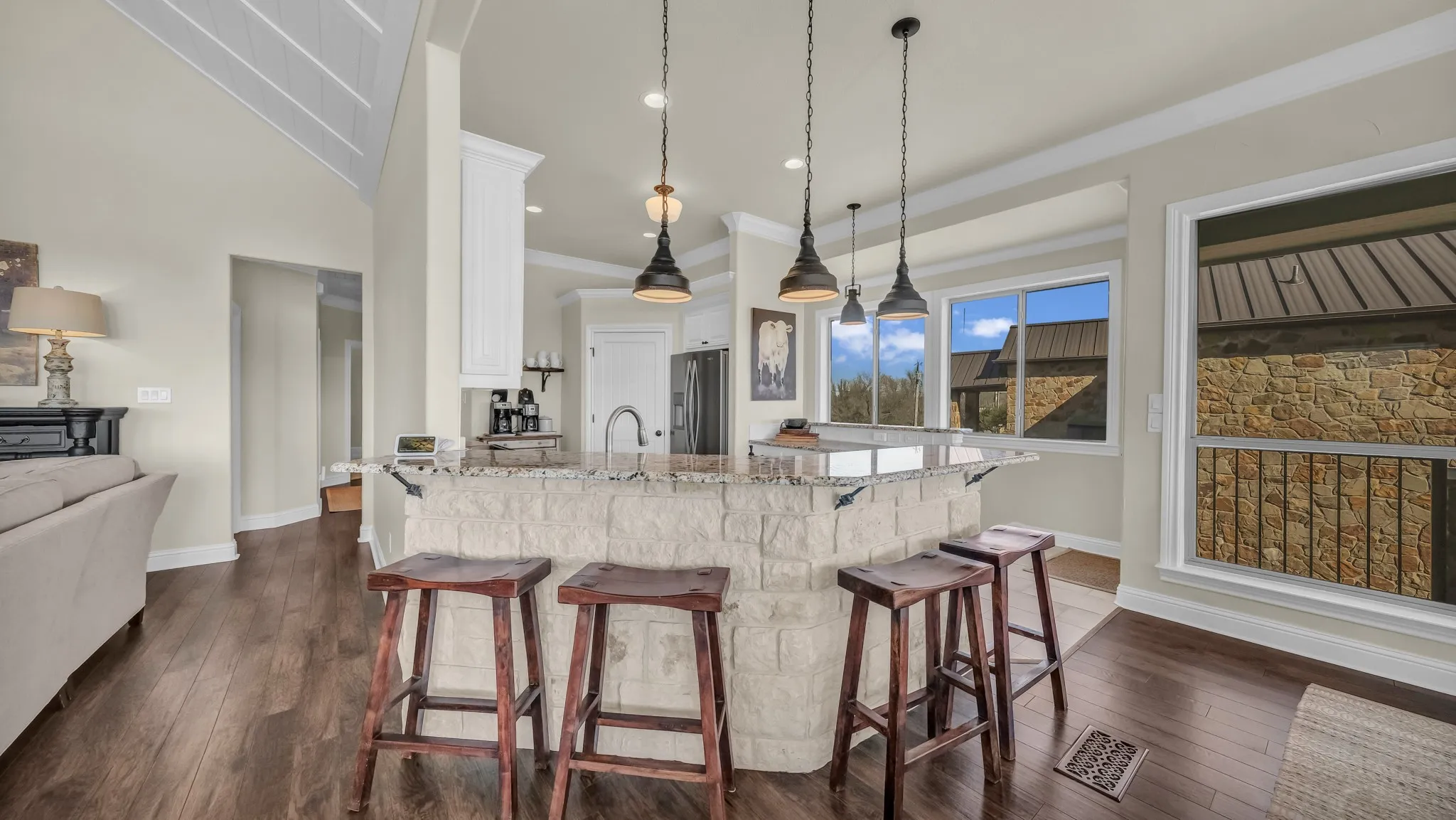 The stone on this breakfast bar area matches the stone on the fireplace.  Super place to sit and enjoy food and fellowship or the stunning views outside the windows.