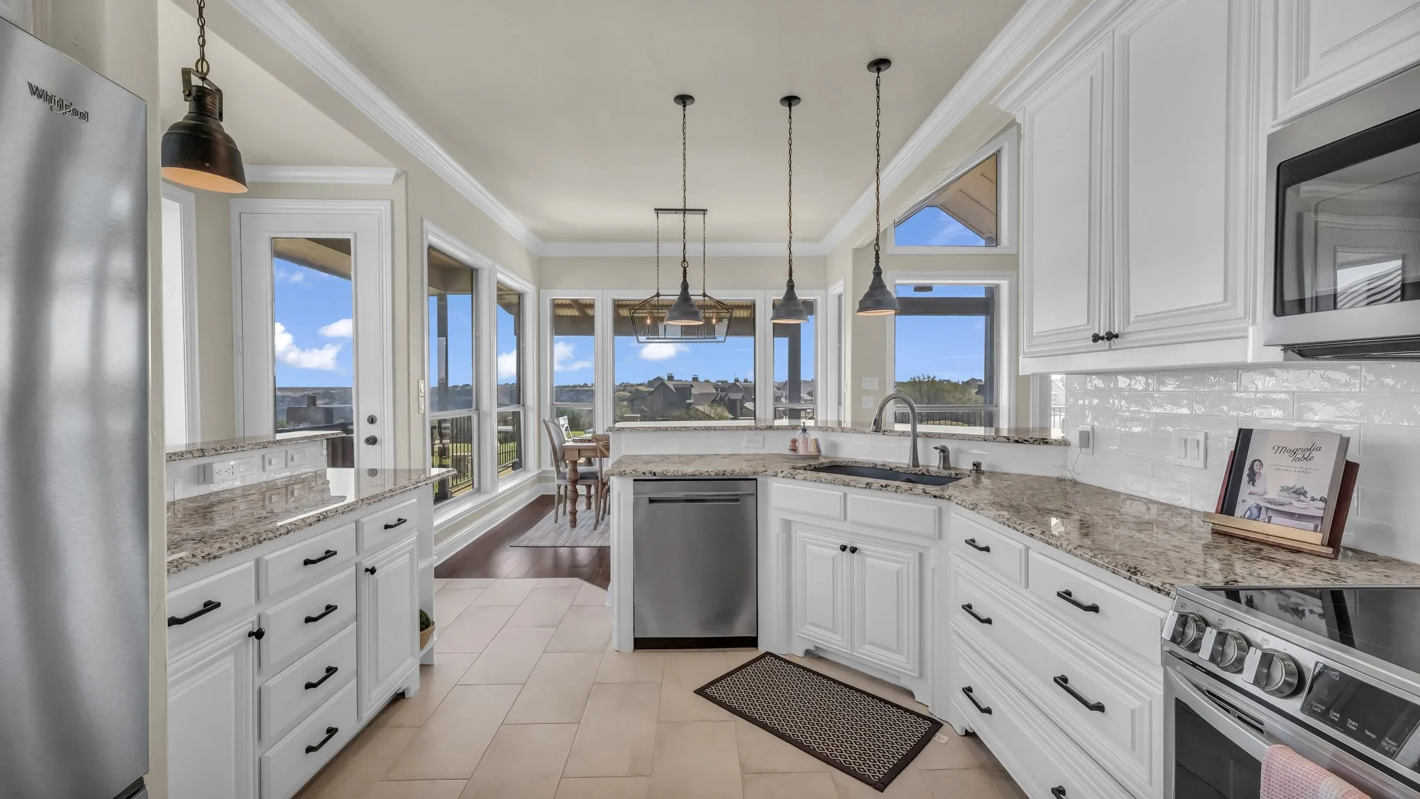 Kitchen is fully remodeled with granite countertops, new appliances and decorative lighting.  You will enjoy those lake and golf course views even from the kitchen area!