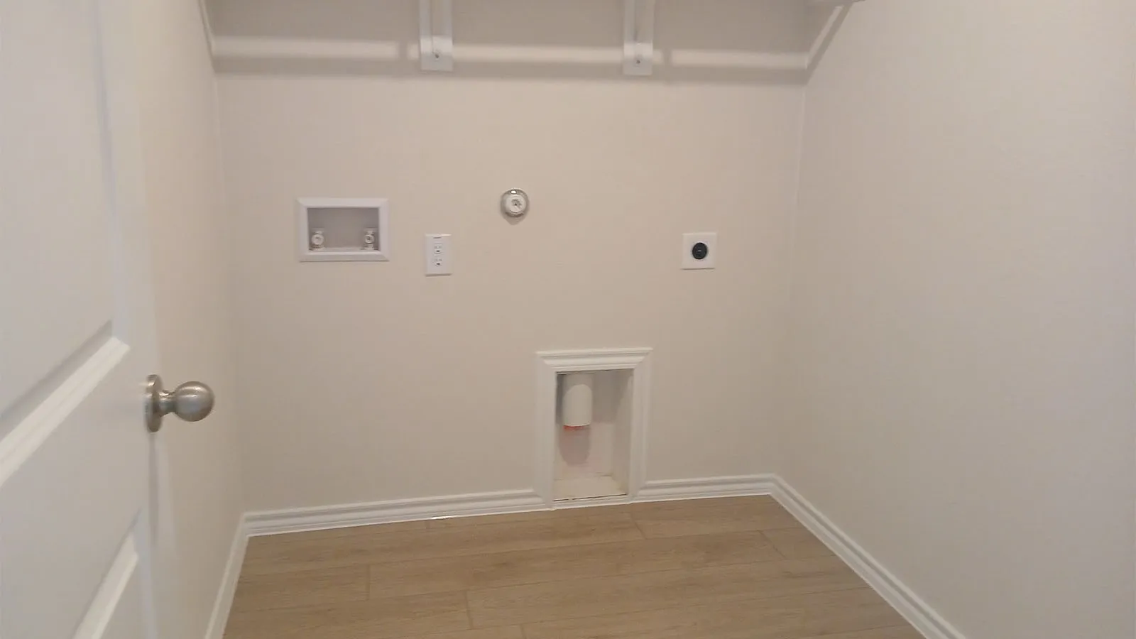 White paneled door with brushed nickel hardware