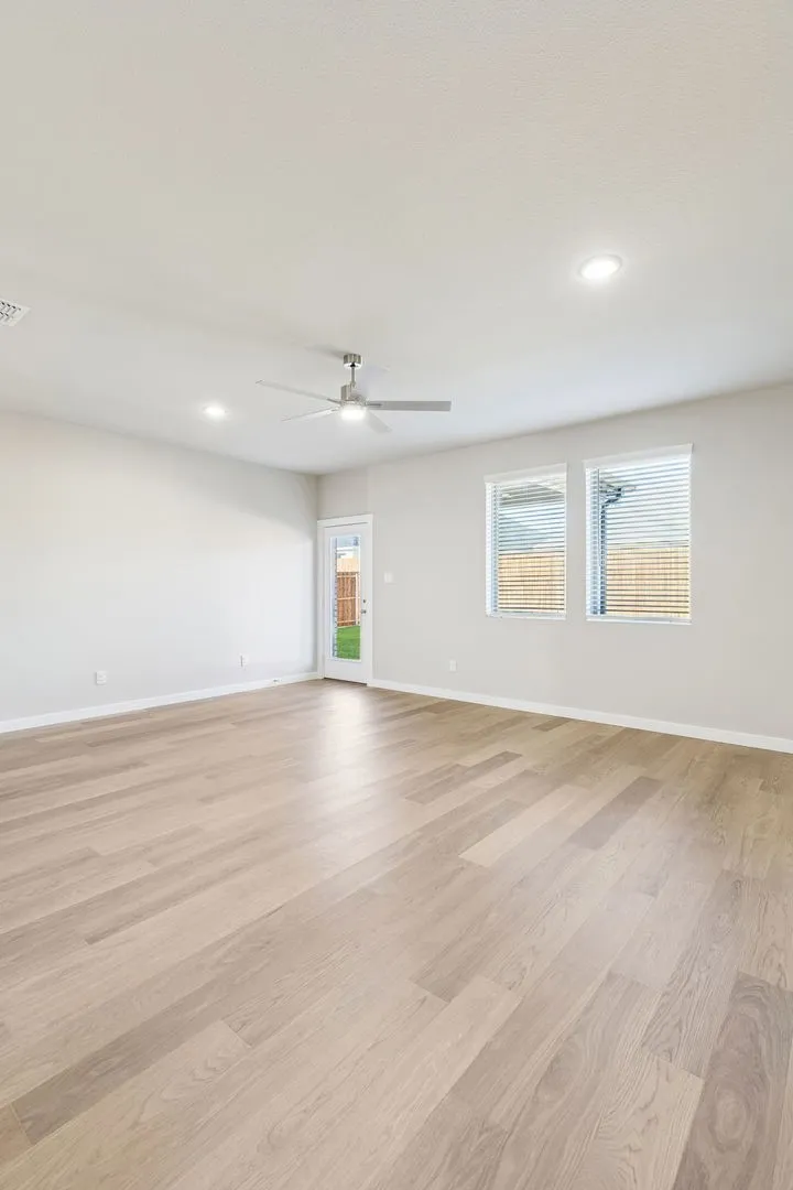 Living Room in the Haylee home plan by Trophy Signature Homes - REPRESENTATIVE PHOTO