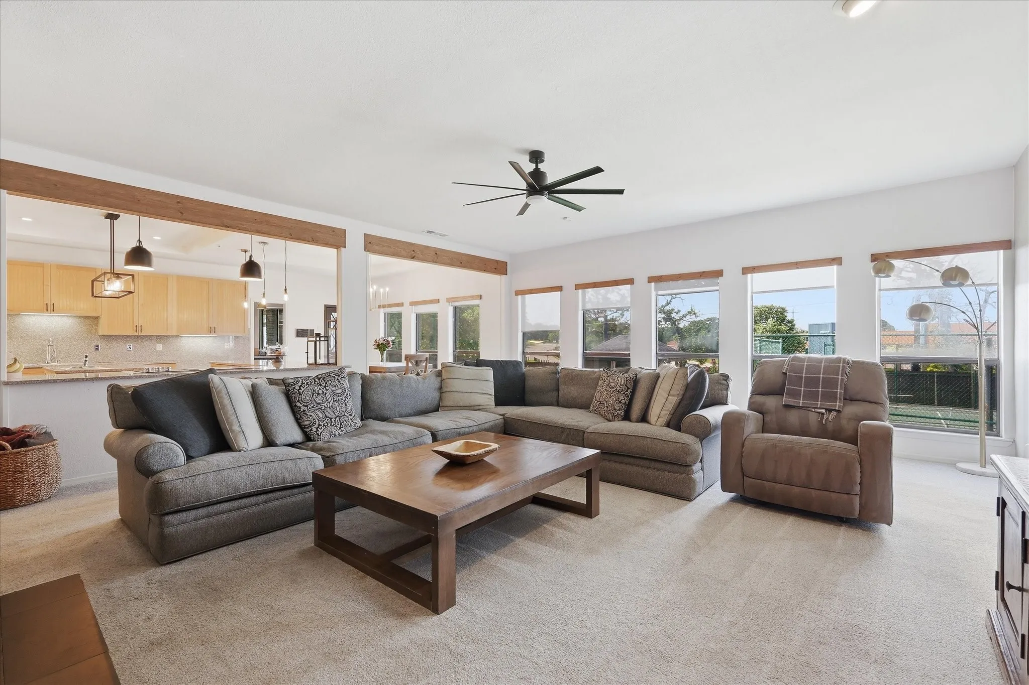 Informal living room that connects directly to the kitchen and breakfast area. Natural lights pours in from the multiple windows
