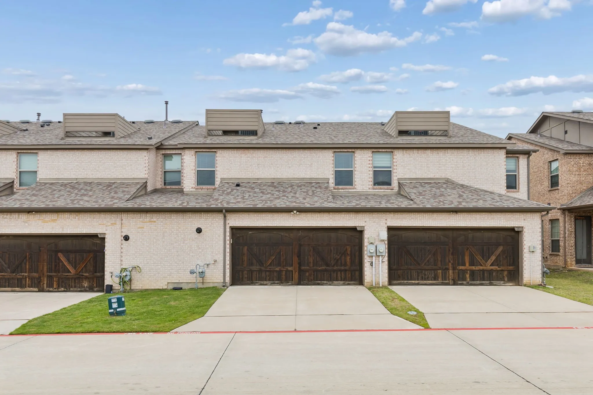 Rear Entry with wood-finish garage door individual concrete driveway
