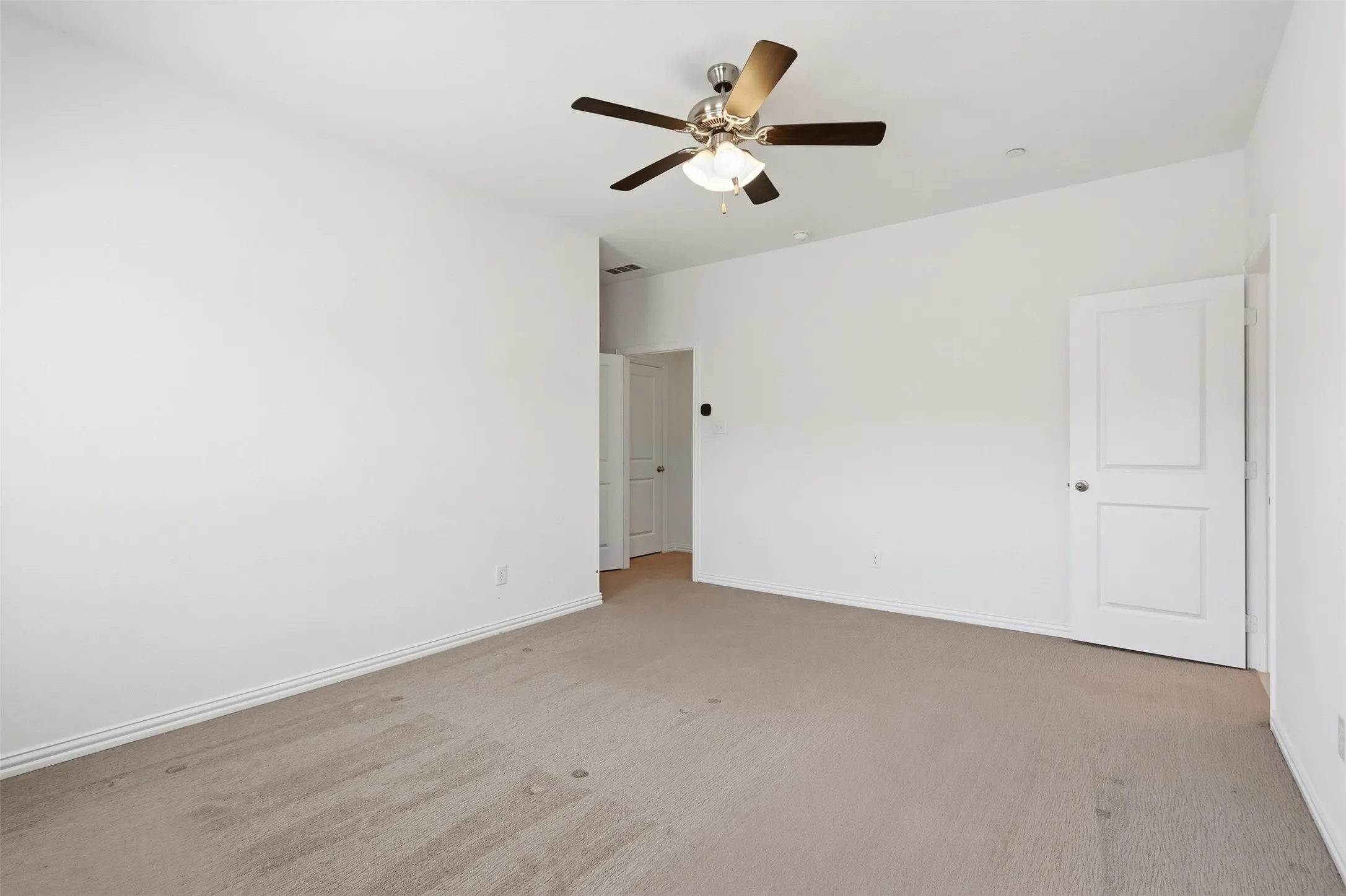 Primary suite upstairs with space for large furniture and has it's own ensuite bathroom and walk-in closet