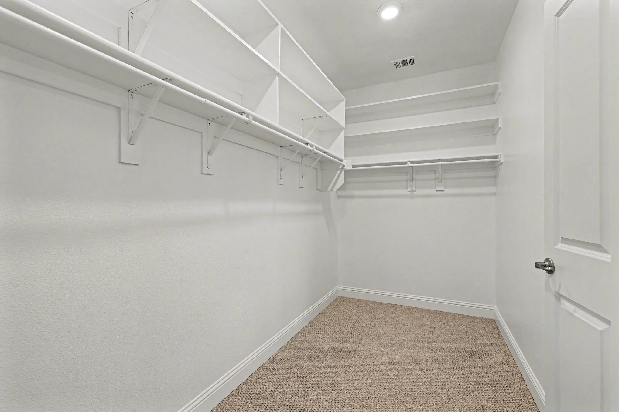 Large Primary Bedroom closet with extra shelving added