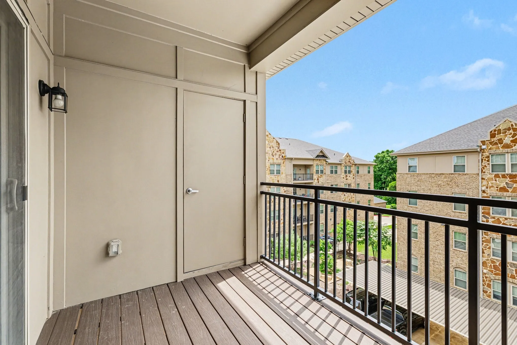Balcony with view of pocket garden between the three buildings