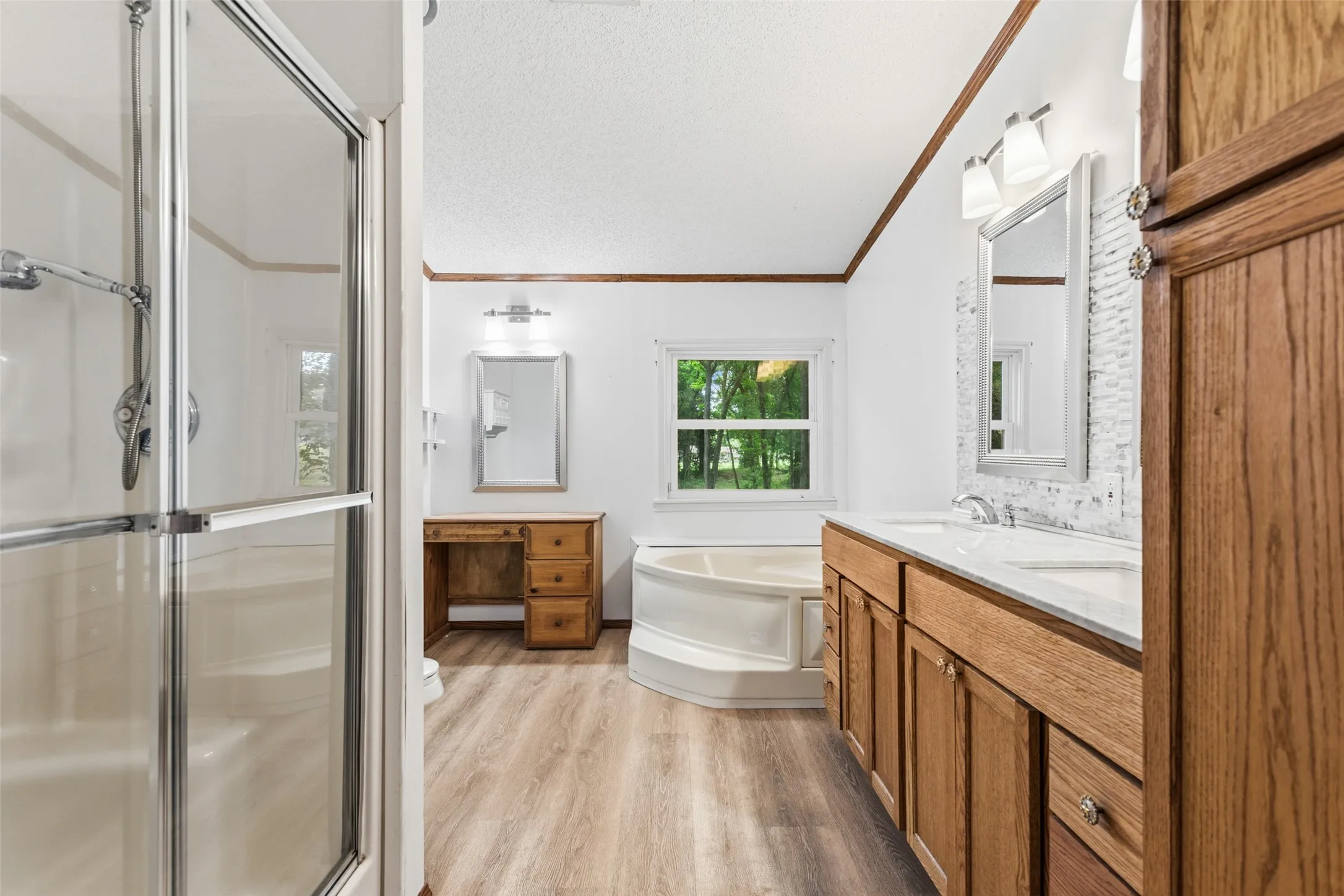 Dual Vanities and Garden Tub with Dressing Area