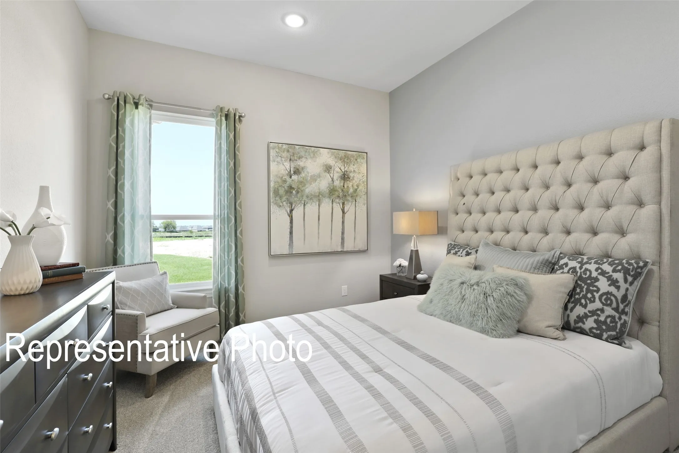Carpeted bedroom featuring a large window, recessed lighting, and light-toned wall finishes