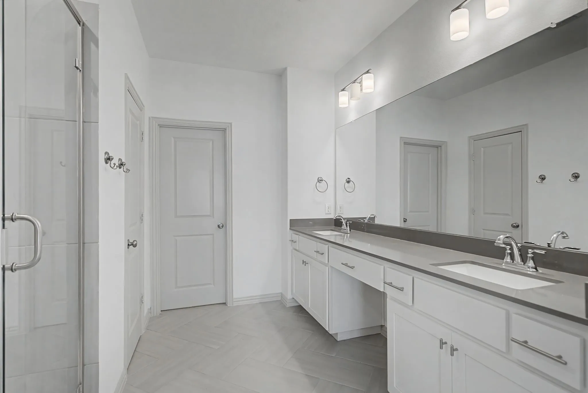 Dual vanity with undermount sinks and chrome fixtures