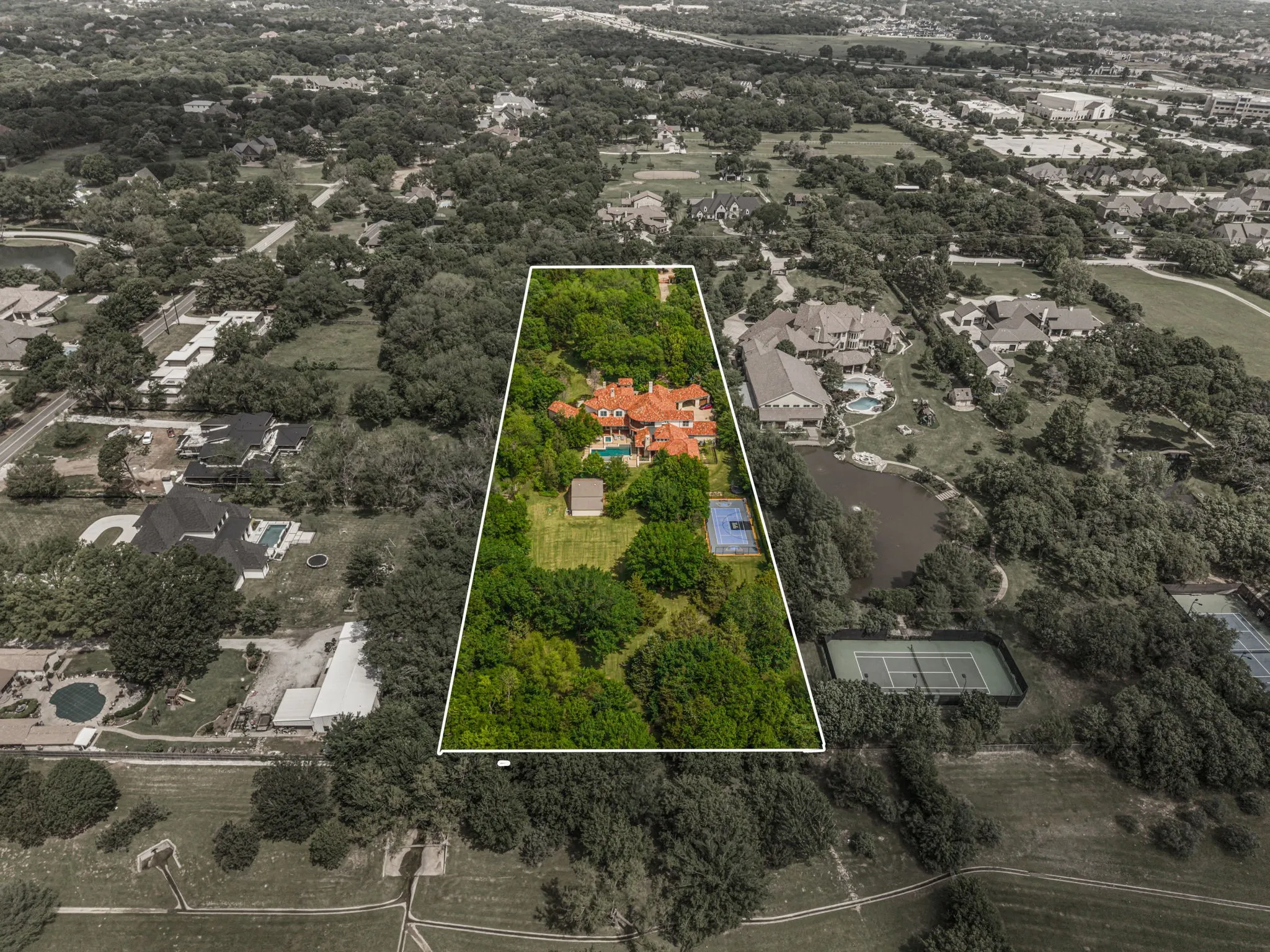 Perfectly situated in the center of the 4.7 acre lot with lawn in the front and back yards with lots of shade from the mature trees