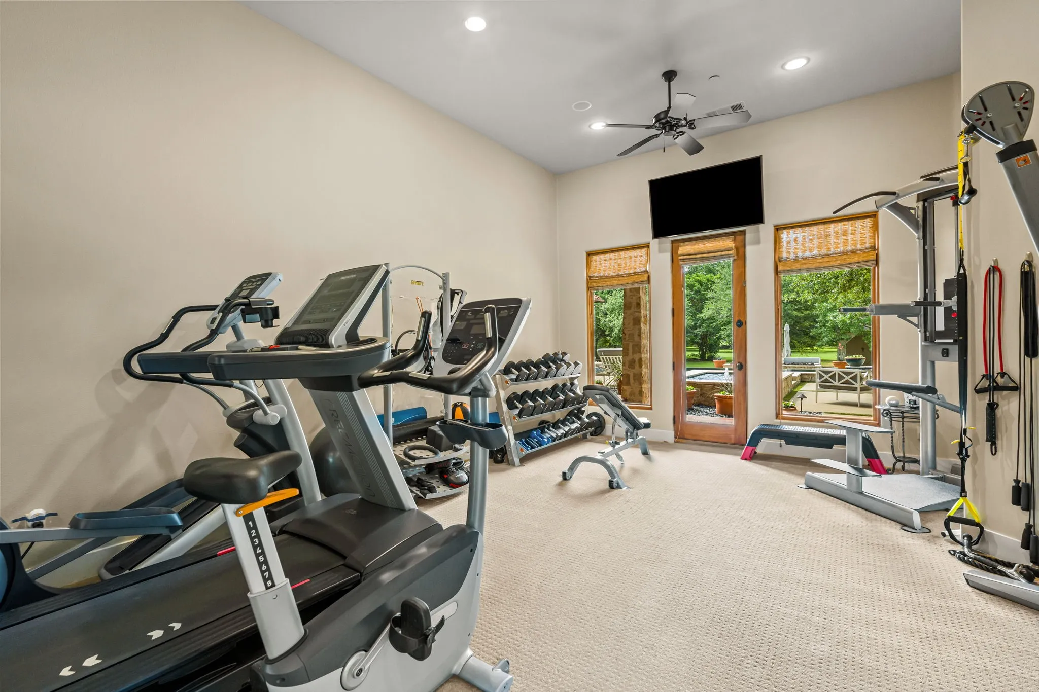 The gym overlooks the pool and spa