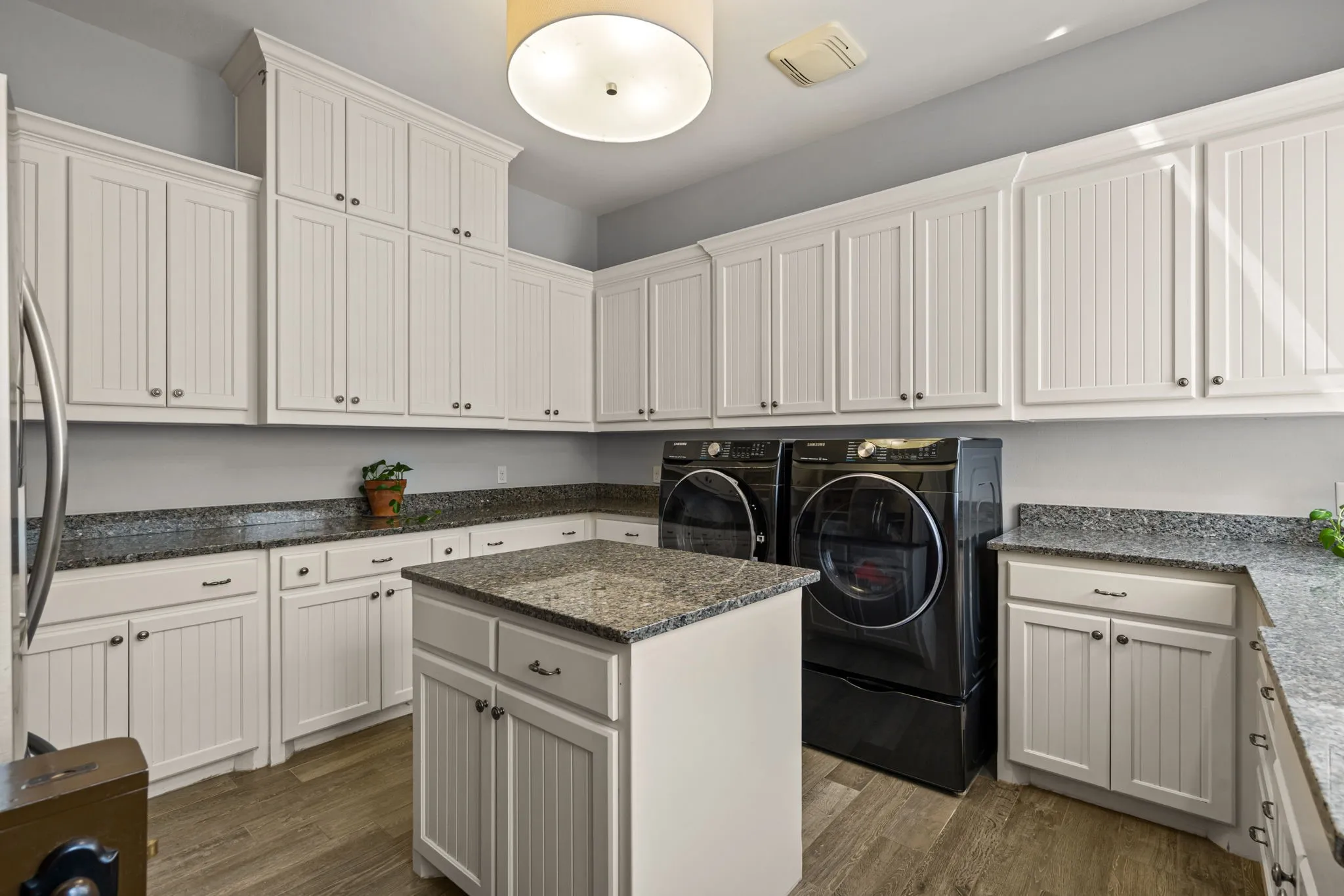 The laundry room with island and dutch door...