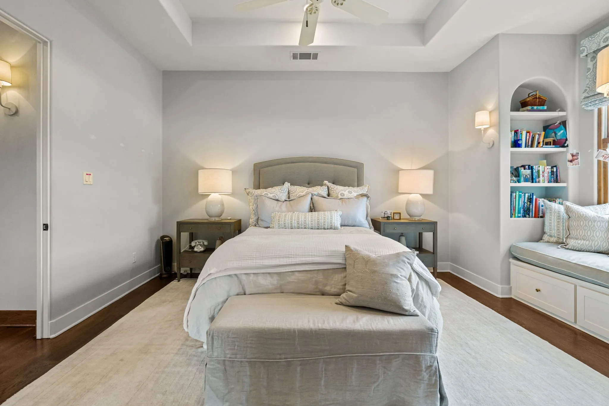 Bedroom with window seat, wood floors; private ensuite bathroom