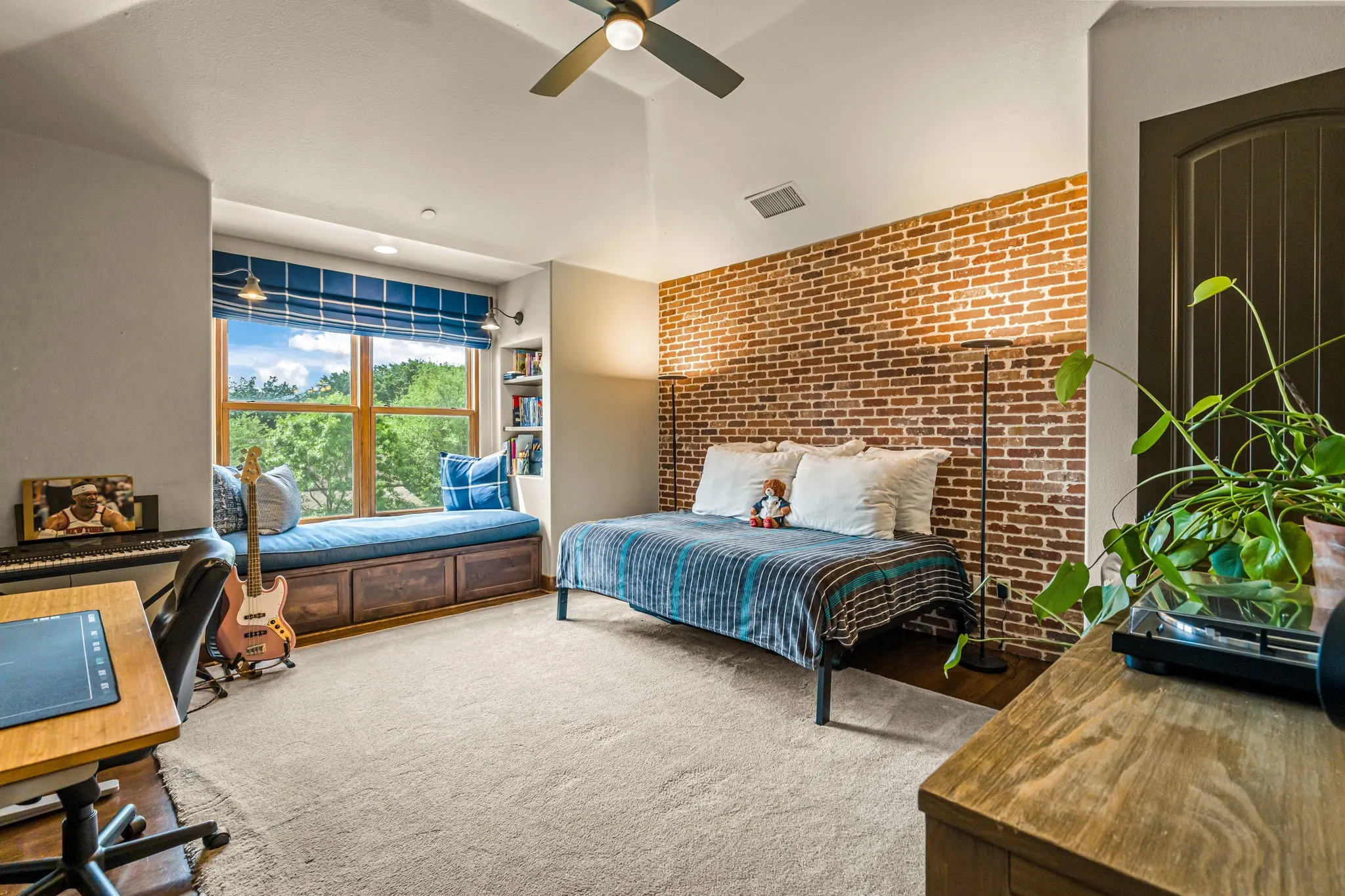 Bedroom with window seat, wood floors, private ensuite bathroom