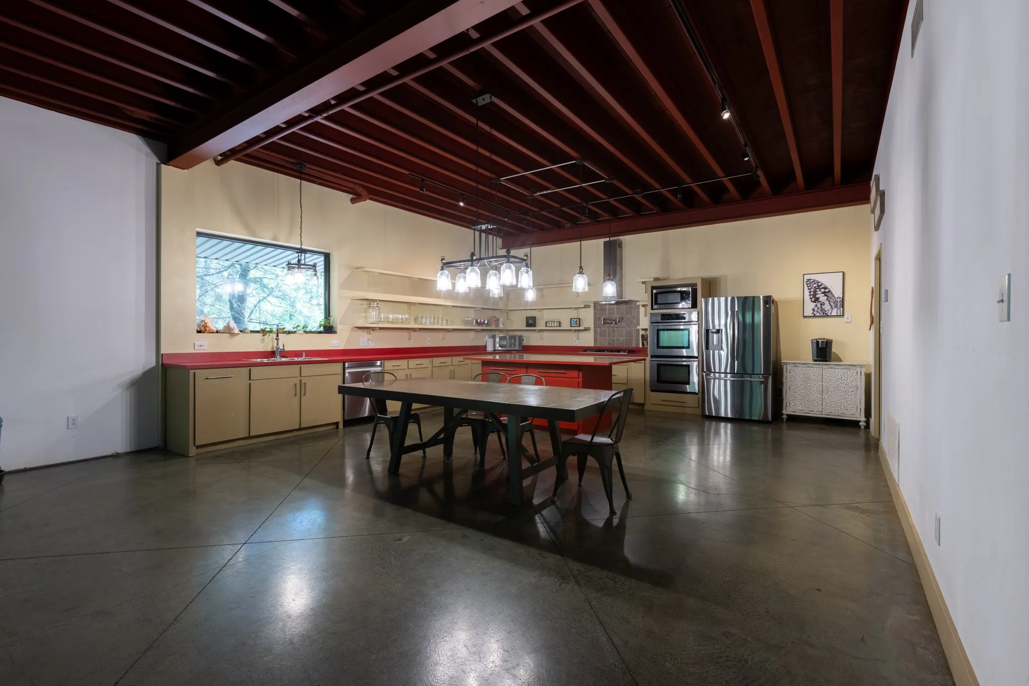 Kitchen and Dining Areas.  Upper Open shelving and cabinets with pullouts below.  5-burner gas cooktop, pot filler and double oven! Huge island!