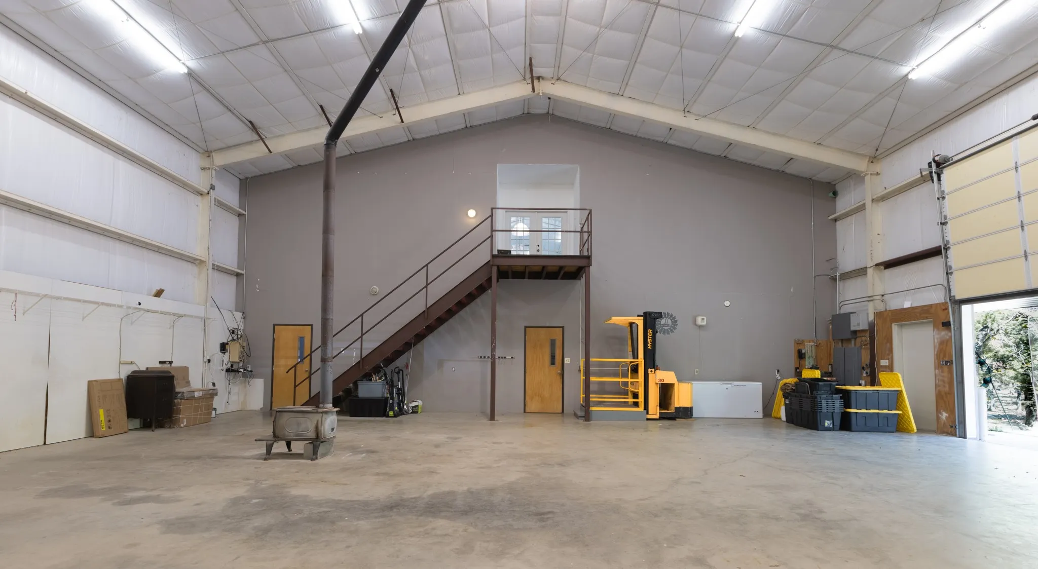 2500 sq ft workshop - barndominium.  Stairs and hydraulic lift lead to upstairs loft are that is 2500 sq ft.