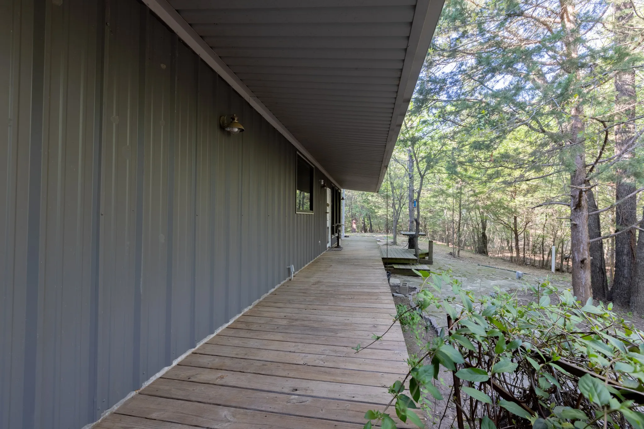 Wraparound porch of main house - Bardominium