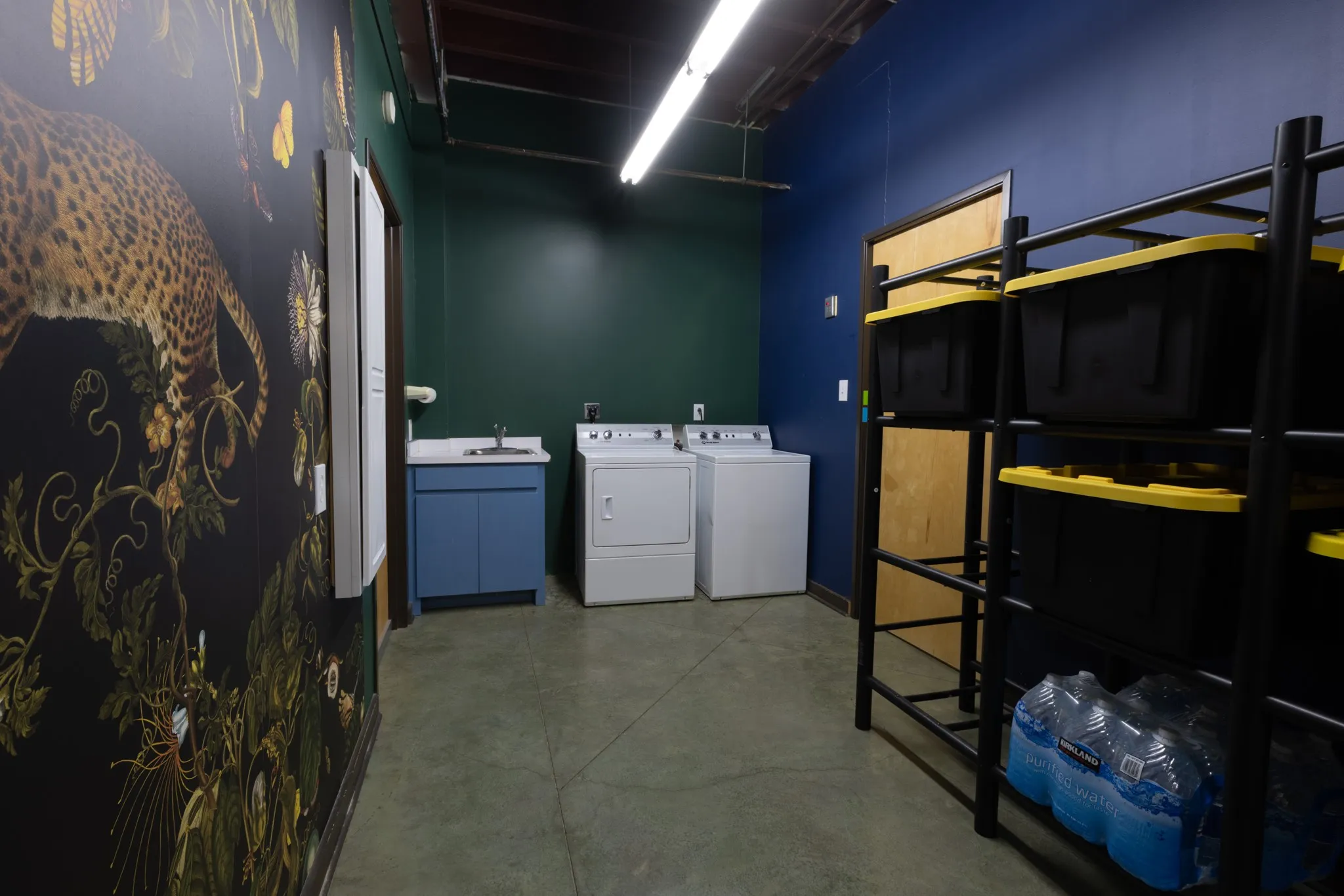 Laundry-Utility room with sink and shelving for extra storage.